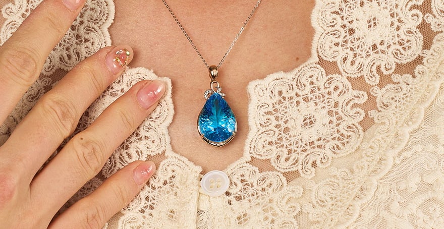 14k Gold 23.79 Ct Natural Topaz & Diamond Pendant( Without Chain ): Ref:231080049 // gold content:14k gold // main gemstone:topaz // shape:pear // carat weight:23. 79ct // color:blue // treatment:natural // // adjacent gemstone 2 : diamond // shape:round // clarity