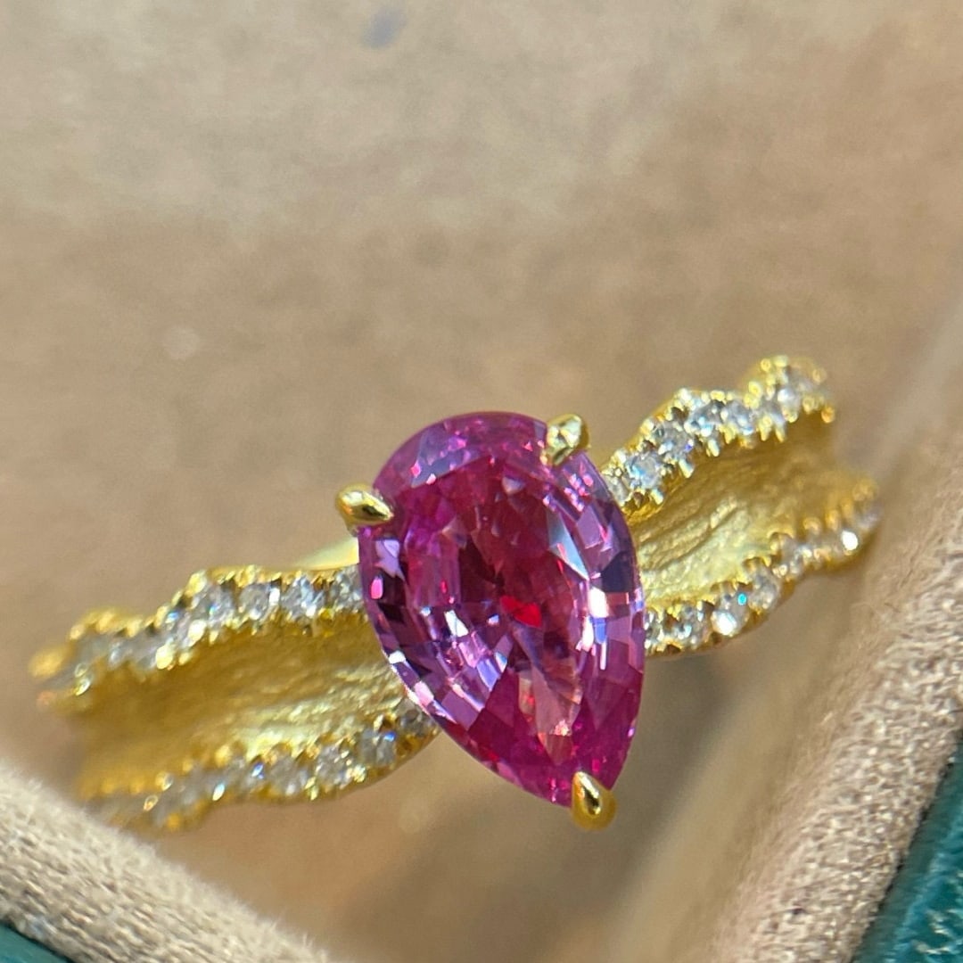 14k Gold 1.30 Ctw Natural Sapphire & Diamond Ring: Ref:231080077 // gold content:14k gold // ring size:7. 25us // // main gemstone:sapphire // shape:pear // carat weight:1. 10ct // color:pink // treatment:natural // // adjacent gemstone 2 : diamond
