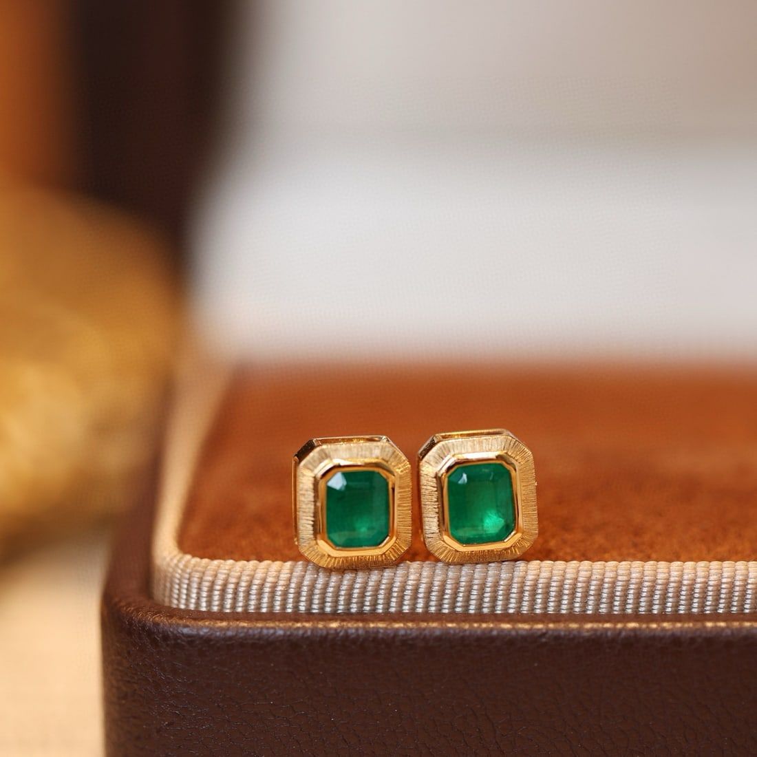 14k Gold 0.87 Ct Vivid Green Natural Emerald Earrings: Ref:231080094 // gold content:14k gold // main gemstone:emerald // shape:octagonal // carat weight:0. 87ct // color:vivid green // treatment:natural // Condition: New High Estimate: 5000 Low