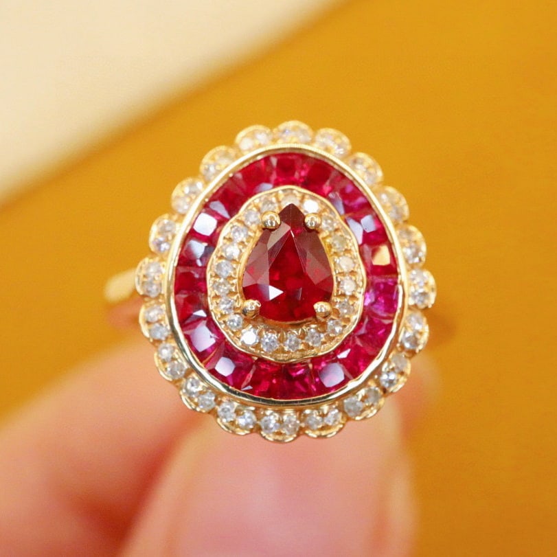 14k Gold 0.61 Ctw Natural Ruby & Diamond Ring: Ref:231085023 // gold content:14k gold // ring size:7. 25us // // main gemstone:ruby // shape:pear // carat weight:0. 43ct // color:red // treatment:natural // // adjacent gemstone 2 : diamond // numb