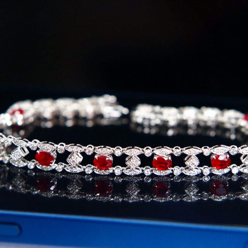 14k Gold 2.81 Ctw Natural Ruby & Diamond Bracelet: Ref:231085030 // gold content:14k gold // main gemstone:ruby // shape:oval // carat weight:1. 95ct // color:pigeonblood red // treatment:natural // // adjacent gemstone 2 : diamond // shape:round //