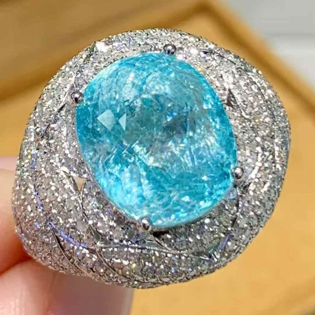 14k Gold 7.19 Ct Natural Paraiba Tourmaline & Diamond Ring: Ref:231085051 // gold content:14k gold // ring size:7. 25us // // main gemstone:paraiba tourmaline // shape:oval // carat weight:7. 19ct // color:blue // treatment:natural // // adjacent gemstone 2 : 