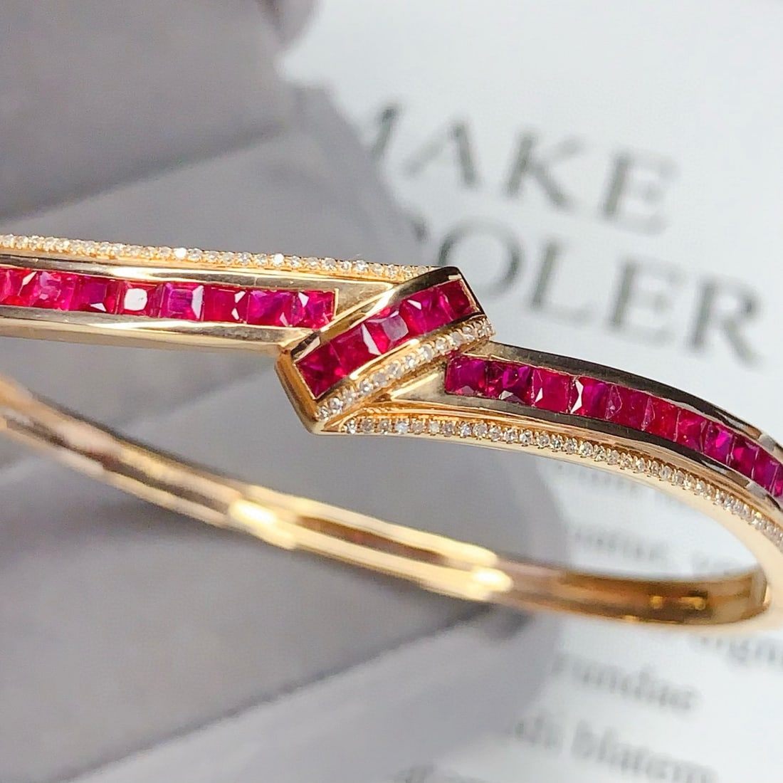14k Gold 5.5 Ct Natural Ruby & Diamond Bangle: Ref:231085108 // gold content:14k gold // main gemstone:ruby // shape:princess // carat weight:5. 5ct // color:red // treatment:natural // // adjacent gemstone 2 : diamond // number of stones:105 //