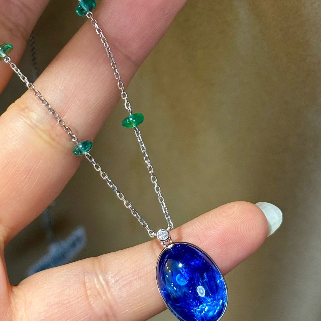14k Gold 16.70 Ctw Natural Tanzanite & Emerald Necklace: Ref:231085167 // gold content:14k gold // main gemstone:tanzanite // shape:oval // carat weight:13. 85ct // color:blue // treatment:natural // // adjacent gemstone 2 : emerald // shape:bead // carat w