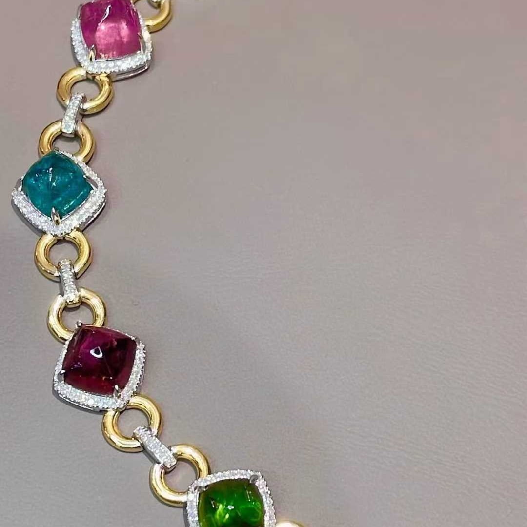 14k Gold 15 Ct Natural Tourmaline & Diamond Bracelet: Ref:231085218 // gold content:14k gold // main gemstone:tourmaline // shape:sugar-loaf // carat weight:15ct // color:color // treatment:natural // // adjacent gemstone 2 : diamond // shape:round //