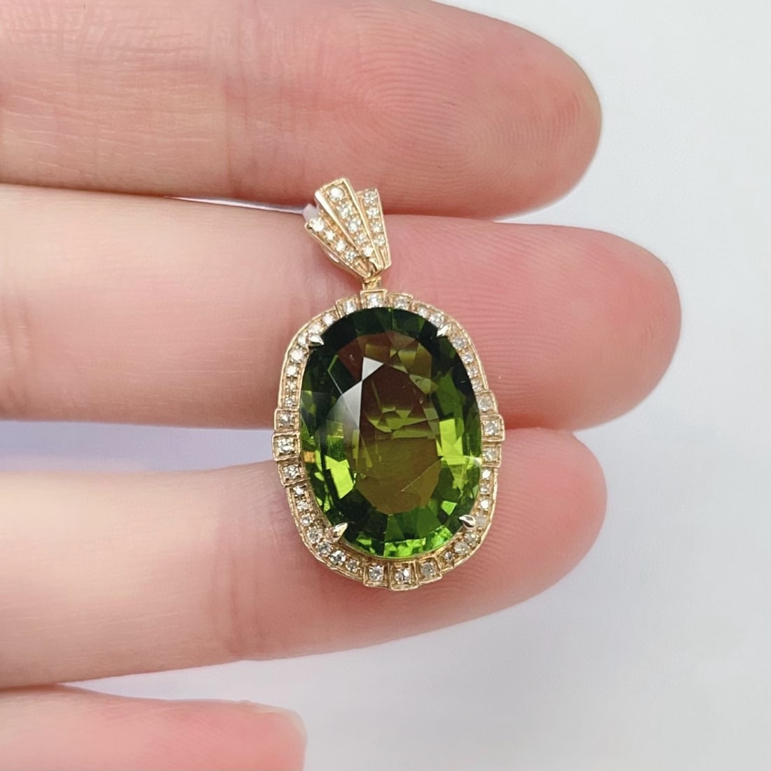 14k Gold 8.12 Ctw Natural Tourmaline & Diamond Pendant( Without Chain ): Ref:231085259 // gold content:14k gold // main gemstone:tourmaline // shape:oval // carat weight:7. 9ct // color:green // treatment:natural // // adjacent gemstone 2 : diamond // shape:round // carat