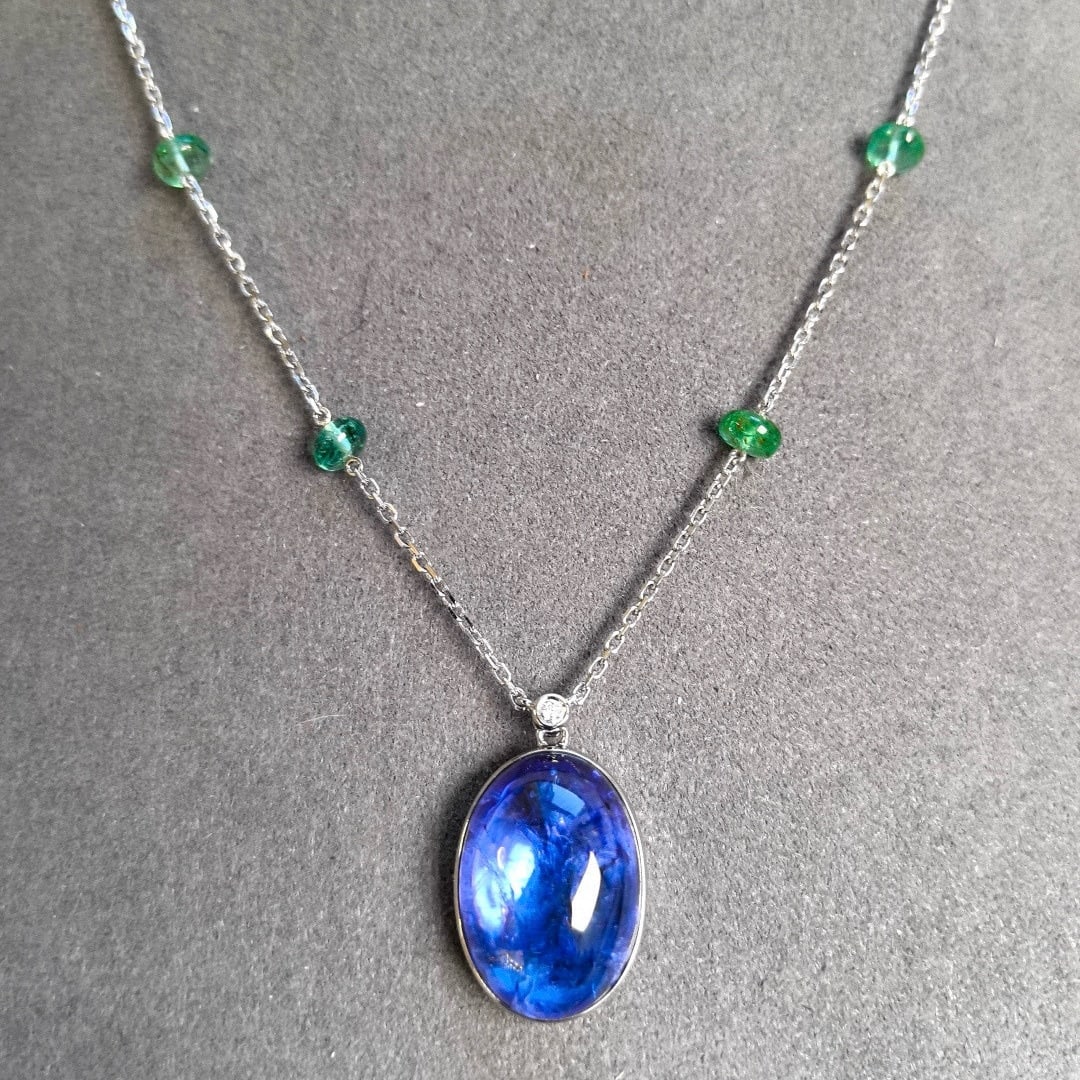 14k Gold 16.70 Ctw Natural Tanzanite & Emerald Necklace: Ref:231086165 // gold content:14k gold // main gemstone:tanzanite // shape:oval // carat weight:13. 85ct // color:blue // treatment:natural // // adjacent gemstone 2 : emerald // shape:bead // carat