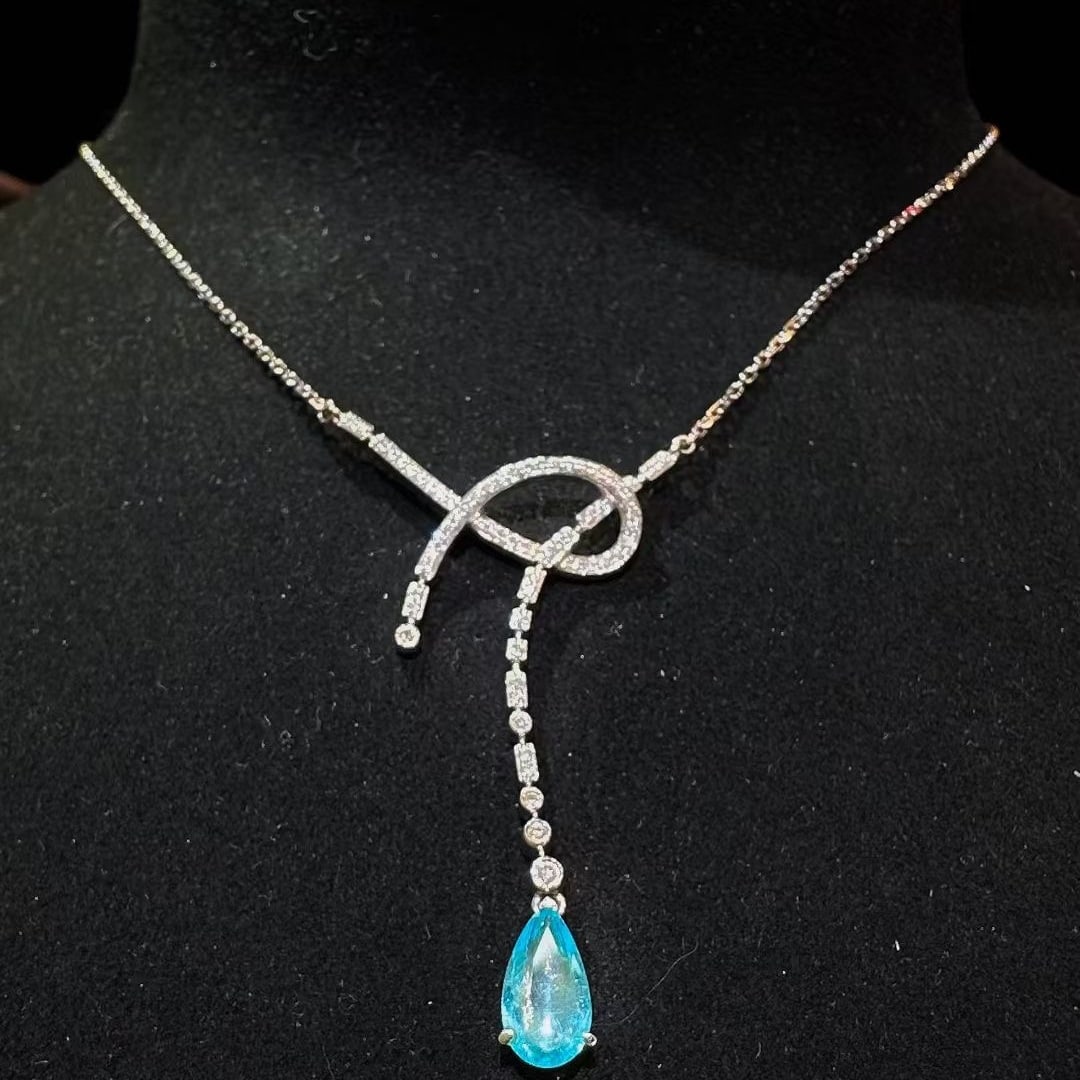 14k Gold 0.98 Ctw Natural Paraiba Tourmaline & Diamond Necklace: Ref:231087012 // gold content:14k gold // main gemstone:paraiba tourmaline // shape:pear // carat weight:0. 77ct // color:blue // treatment:natural // // adjacent gemstone 2 : diamond // shape:round