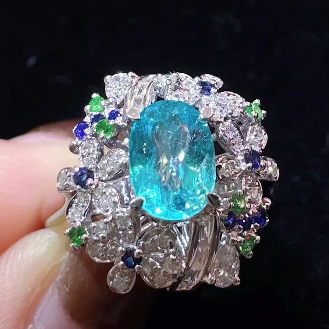 14k Gold 1.20 Ctw Natural Paraiba Tourmaline & Diamond Ring: Ref:231087013 // gold content:14k gold // ring size:7. 25 us // // main gemstone:paraiba tourmaline // shape:oval // carat weight:0. 92ct // color:blue // treatment:natural // // adjacent gemstone 2