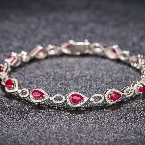 14k Gold 3.78 Ctw Natural Ruby & Diamond Bracelet: Ref:231087033 // gold content:14k gold // main gemstone:ruby // shape:pear // carat weight:3. 04ct // color:red // treatment:natural // // adjacent gemstone 2 : diamond // shape:round // carat weight: