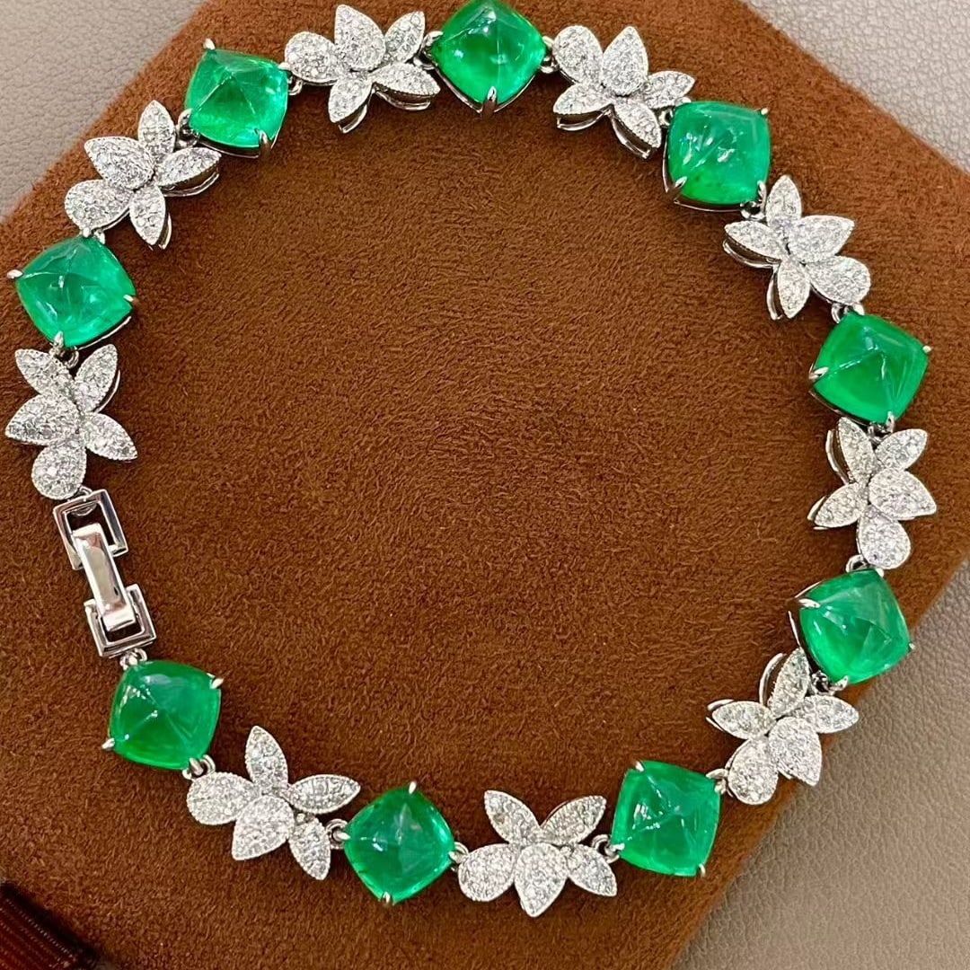 14k Gold 13.56 Ctw Vivid Green Natural Emerald & Diamond Bracelet: Ref:231087114 // gold content:14k gold // main gemstone:emerald // shape:sugar-loaf // carat weight:12. 26ct // color:vivid green // treatment:natural // // adjacent gemstone 2 : diamond // shape:roun