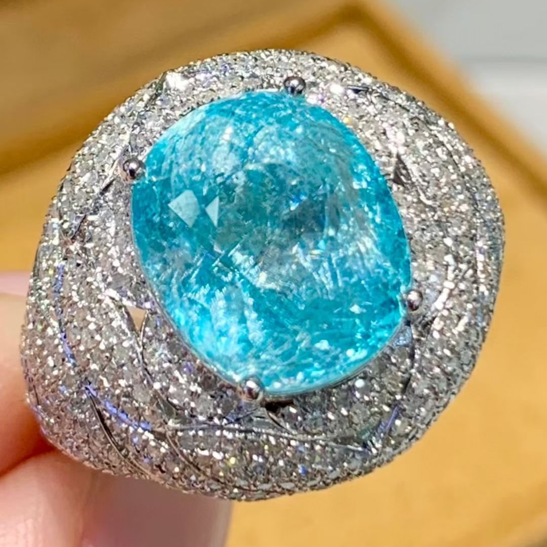 14k Gold 7.19 Ct Natural Paraiba Tourmaline & Diamond Ring: Ref:231087126 // gold content:14k gold // ring size:7. 25 us // // main gemstone:paraiba tourmaline // shape:oval // carat weight:7. 19ct // color:blue // treatment:natural // // adjacent gemstone 2