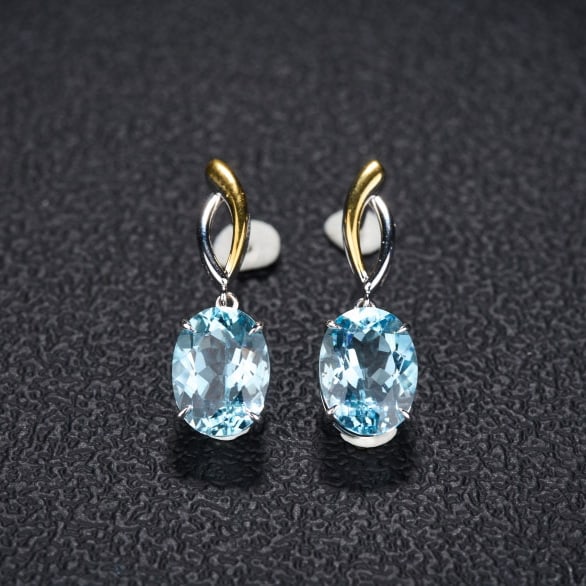 14k Gold 5.8 Ct Natural Aquamarine Earrings: Ref:231087165 // gold content:14k gold // main gemstone:aquamarine // shape:oval // carat weight:5. 8ct // color:santa maria color // treatment:natural // Condition: New Low Estimate: 4800.00 High Est