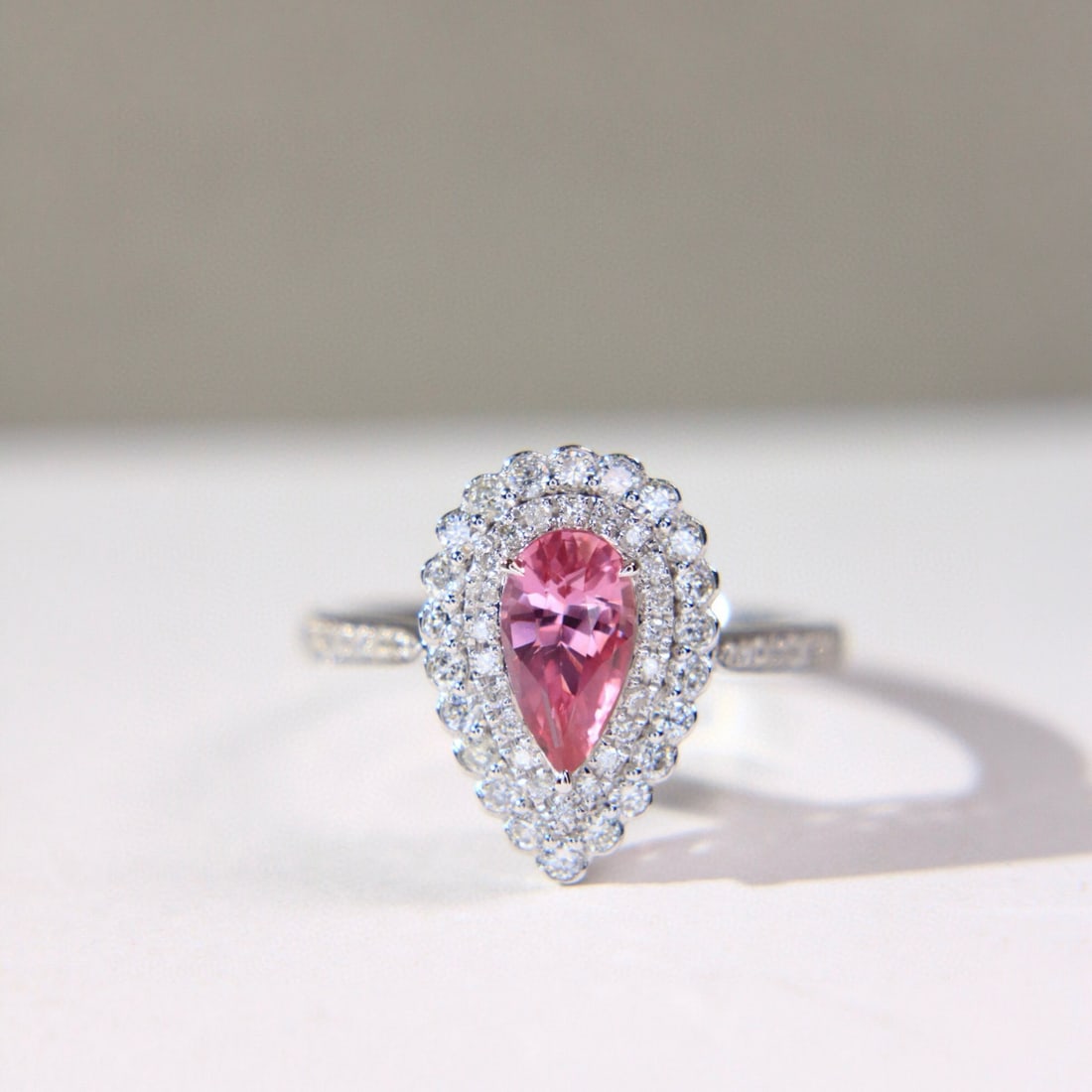 14k Gold 1.49 Ctw Natural Padparadscha Sapphire & Diamond Ring: Ref:231088012 // gold content:14k gold // ring size:7. 25us // // main gemstone:padparadscha sapphire // shape:pear // carat weight:1. 03ct // color:orangish pink // treatment:natural // // adjacent