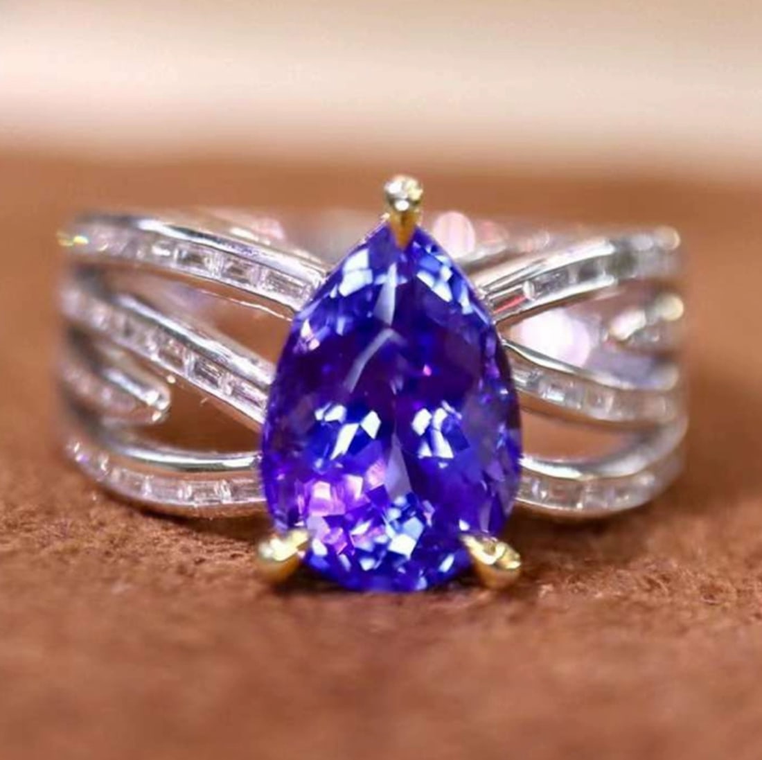 14k Gold 3.03 Ctw Natural Tanzanite & Diamond Ring: Ref:231088054 // gold content:14k gold // ring size:7. 25us // // main gemstone:tanzanite // shape:pear // carat weight:2. 60ct // color:blue // treatment:natural // // adjacent gemstone 2 : diamond