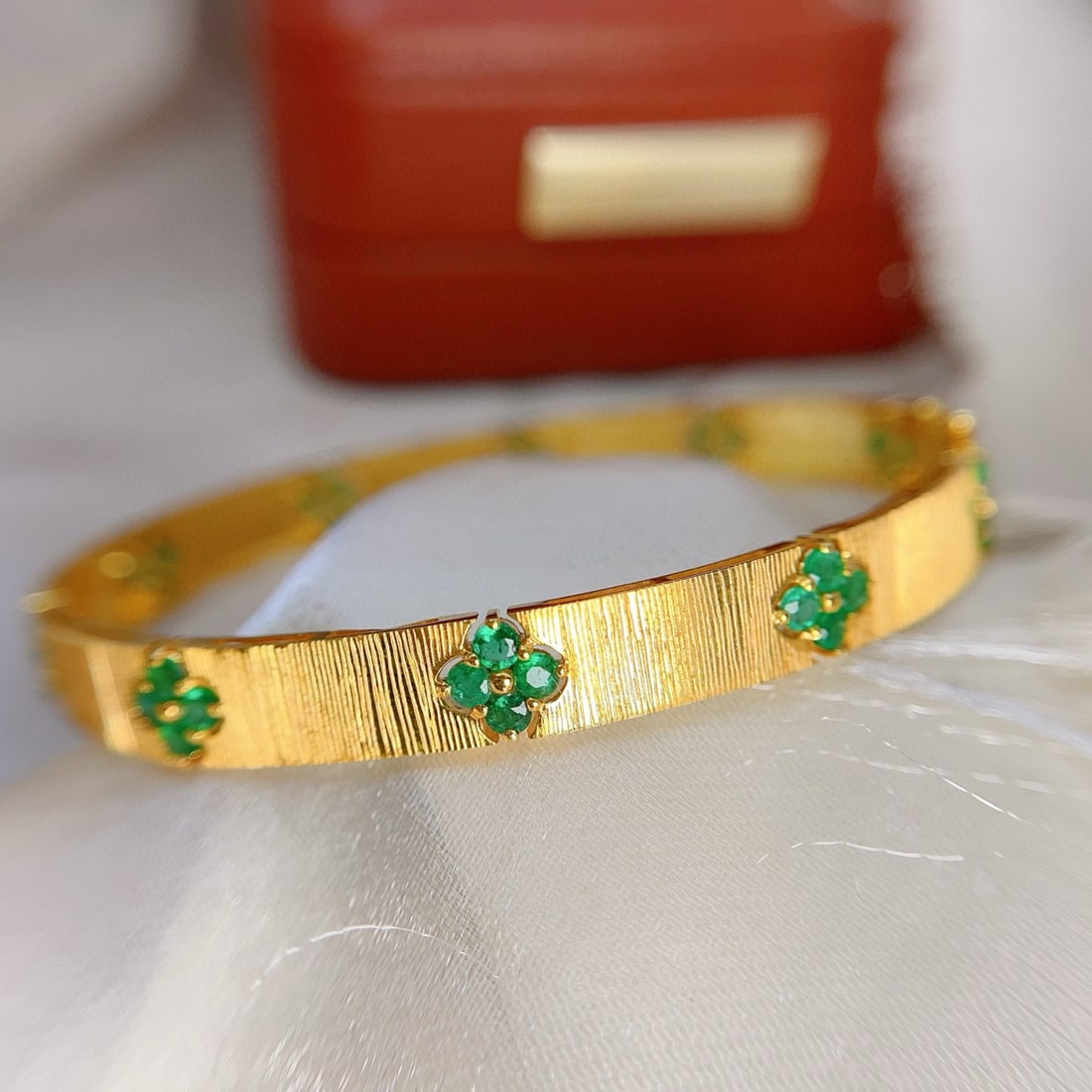 14k Gold 3.50 Ct Natural Emerald Bangle: Ref:231088205 // gold content:14k gold // main gemstone:emerald // shape:round // carat weight:3. 50ct // color:green // treatment:natural // cut grade:g // Condition: New Low Estimate: 11000.00 High