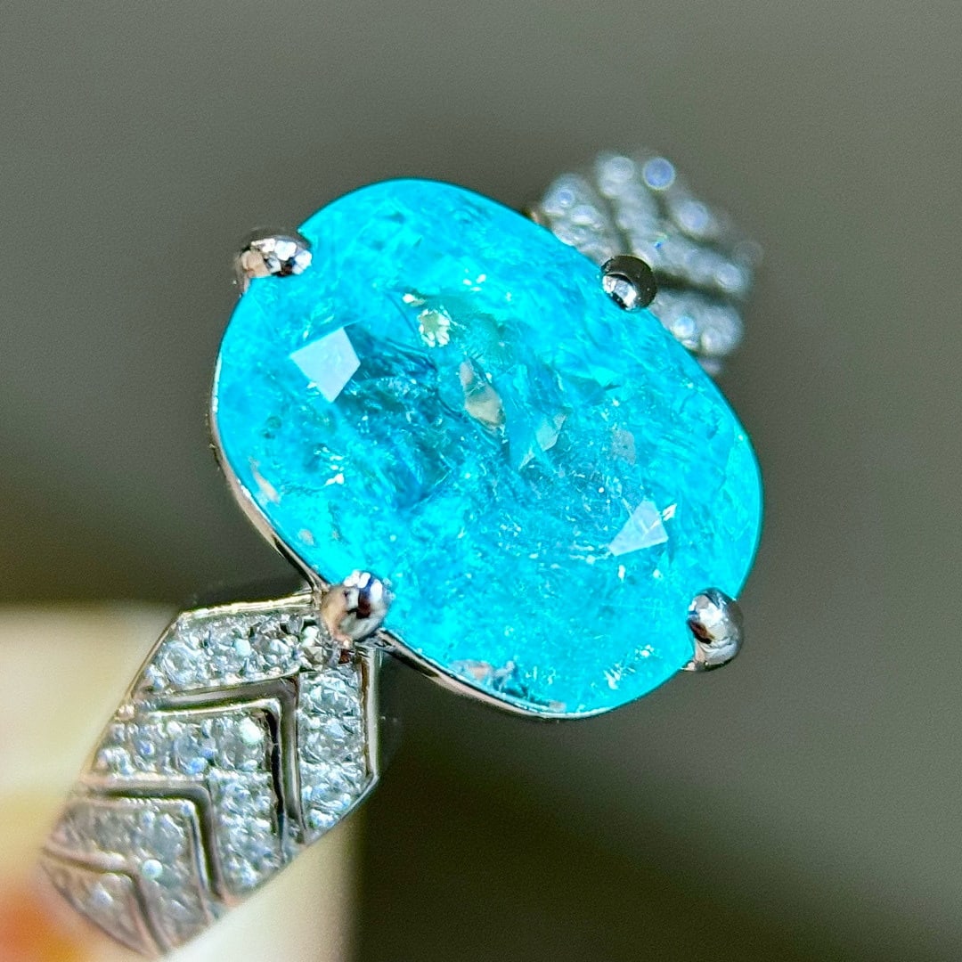 14k Gold 3.91 Ctw Natural Paraiba Tourmaline & Diamond Ring: Ref:231088399 // gold content:14k gold // ring size:7. 25us // // main gemstone:paraiba tourmaline // shape:oval // carat weight:3. 75ct // color:blue // treatment:natural // // adjacent gemstone 2 :