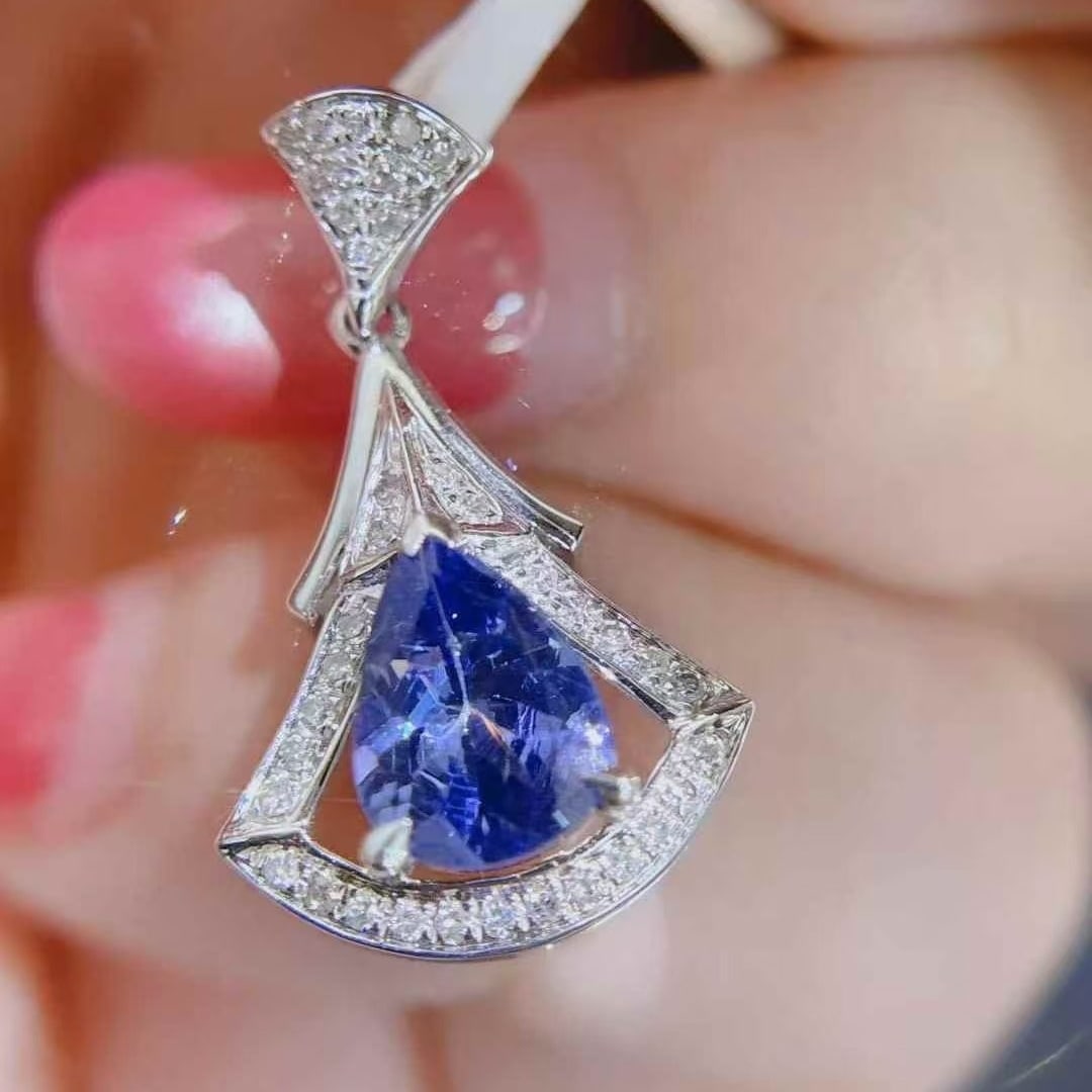14k Gold 1.08 Ctw Natural Tanzanite & Diamond Pendant( Without Chain ): Ref:231091087 // gold content:14k gold // main gemstone:tanzanite // shape:pear // carat weight:1. 0ct // color:blue // treatment:natural // // adjacent gemstone 2 : diamond // shape:round // carat