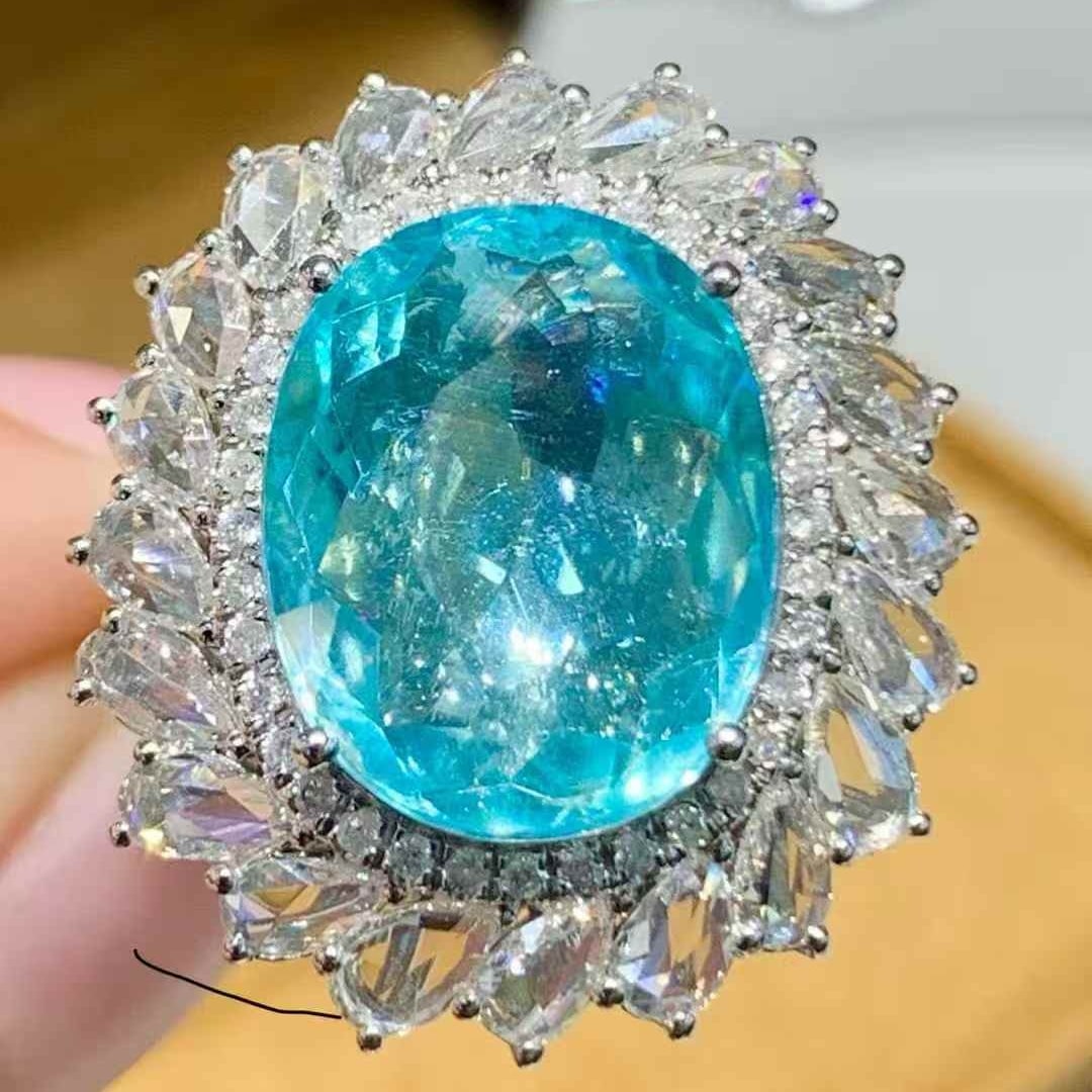 14k Gold 7.12 Ct Natural Paraiba Tourmaline & Diamond Ring: Ref:231091125 // gold content:14k gold // ring size:7. 25us // // main gemstone:paraiba tourmaline // shape:oval // carat weight:7. 12ct // color:blue // treatment:natural // // adjacent gemstone 2 : 