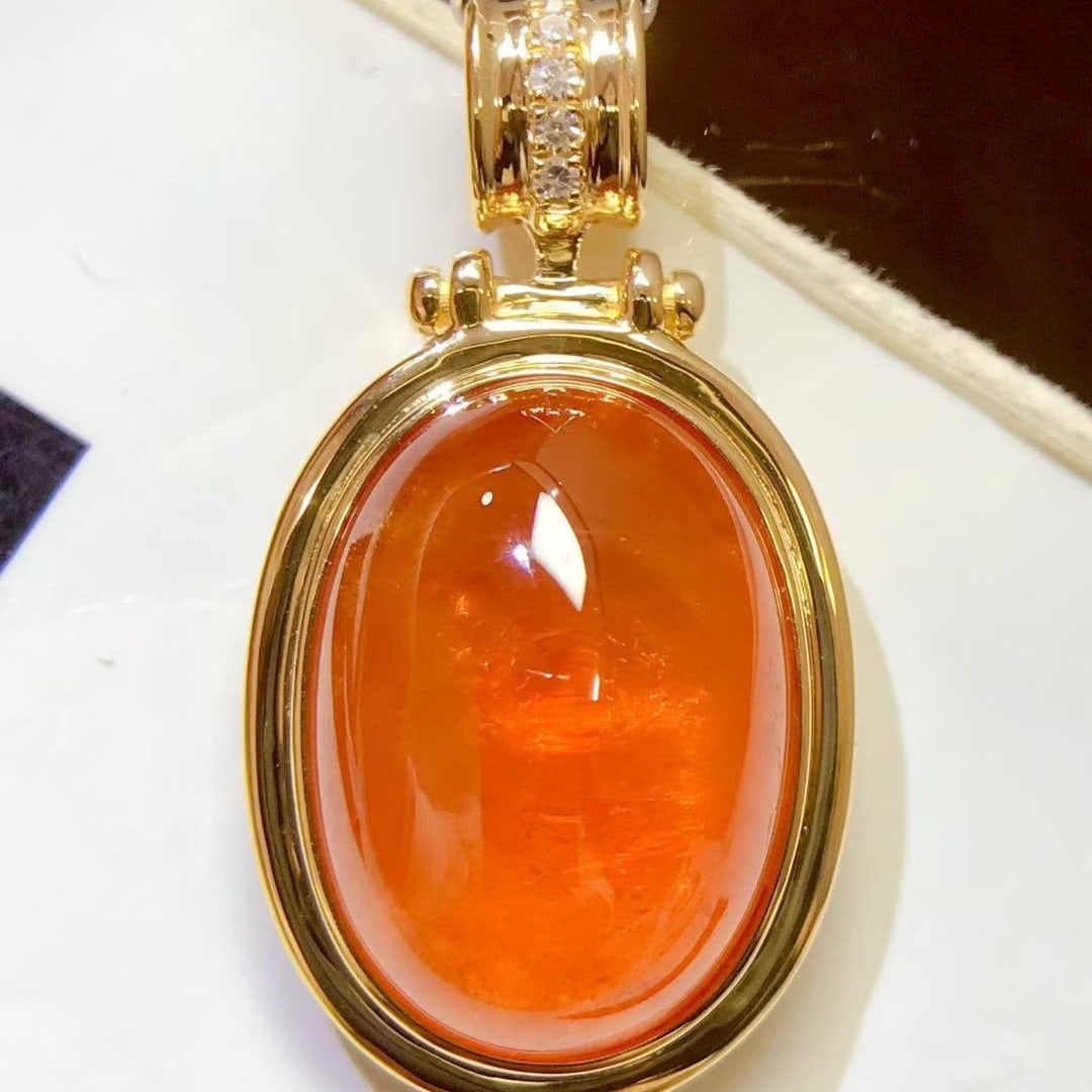 14k Gold 13.2 Ct Natural Spessartine & Diamond Pendant( Without Chain ): Ref:231091127 // gold content:14k gold // main gemstone:spessartine // shape:oval // carat weight:13. 2ct // color:orange // treatment:natural // // adjacent gemstone 2 : diamond // number of