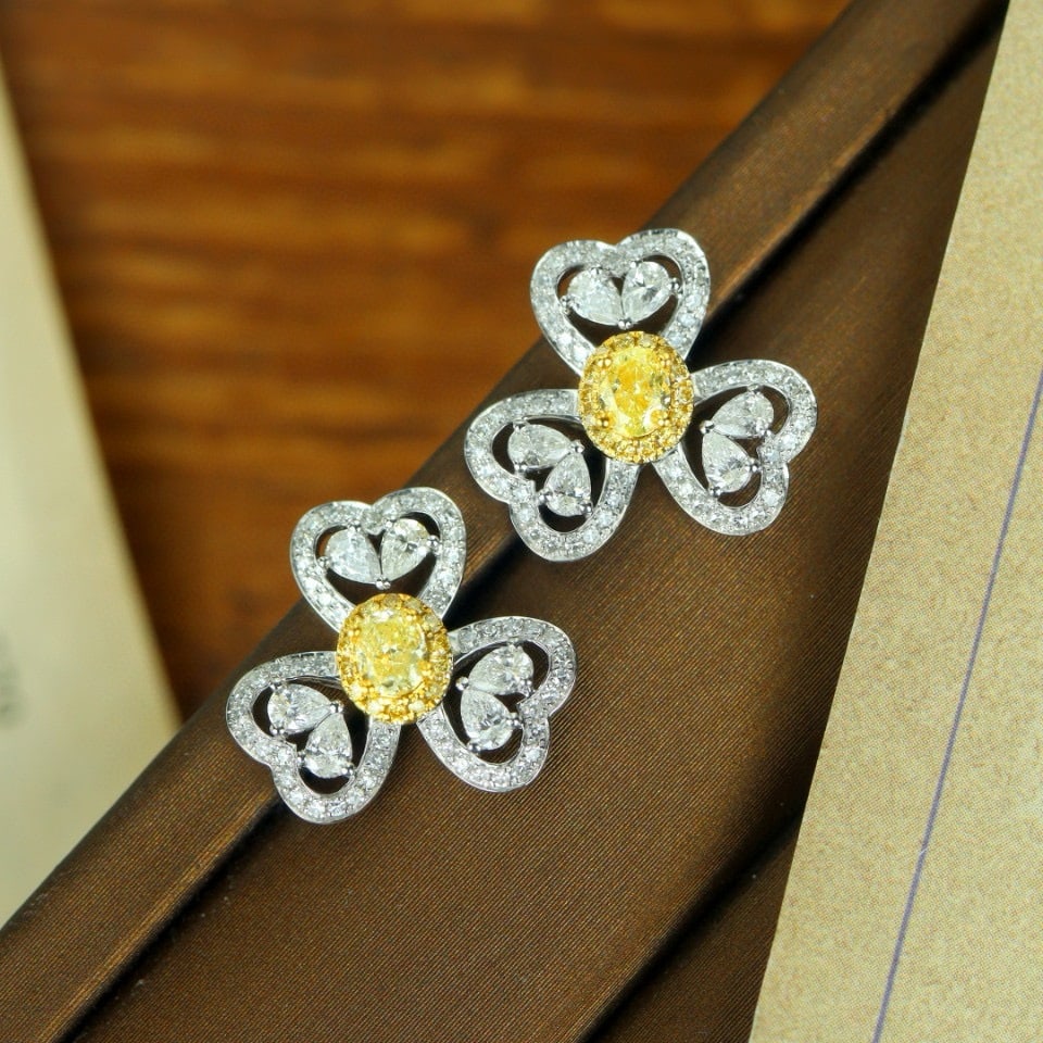 14k Gold 1.36 Ctw Natural Yellow Diamond & Diamond Earrings: Ref:231091151 // gold content:14k gold // main gemstone:yellow diamond // shape:oval // carat weight:0. 40ct // color:yellow // treatment:natural // // adjacent gemstone 2 : diamond // shape:multiple 