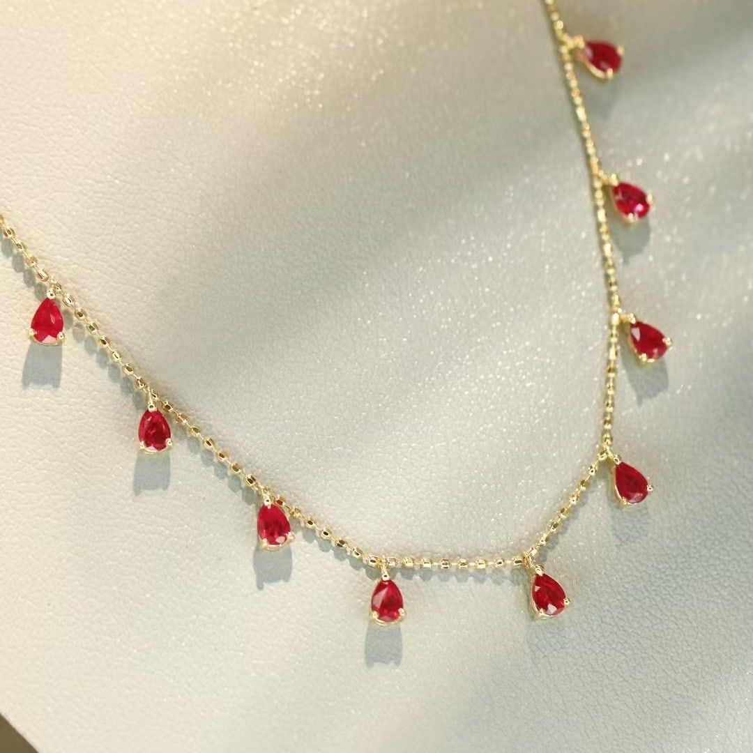 14k Gold 1 Ct Natural Ruby Necklace: Ref:231091158 // gold content:14k gold // main gemstone:ruby // shape:pear // carat weight:1ct // color:red // treatment:natural // Condition: New Low Estimate: 1800.00 High Estimate: 2600.00