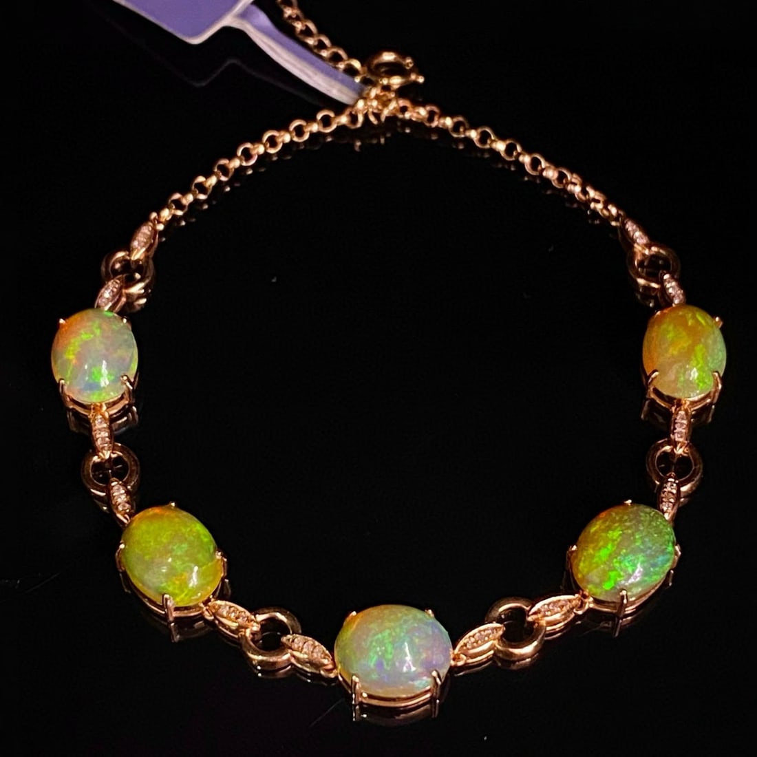 14k Gold 6.05 Ct Natural Opal & Diamond Bracelet: Ref:231091185 // gold content:14k gold // main gemstone:opal // shape:oval // carat weight:6. 05ct // color:color // treatment:natural // // adjacent gemstone 2 : diamond // number of stones:36 // sha