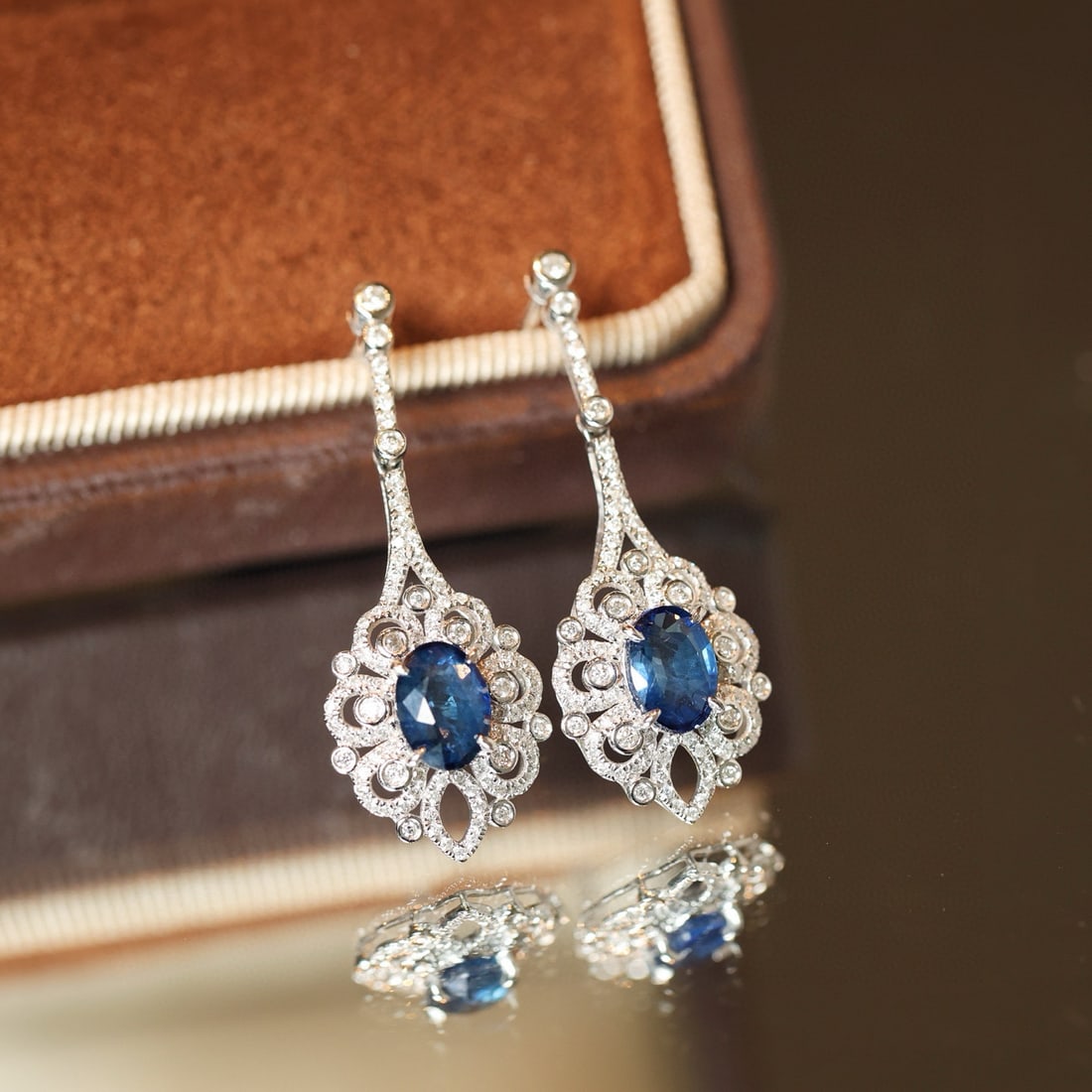 14k Gold 2.76 Ctw Natural Sapphire & Diamond Earrings: Ref:231091221 // gold content:14k gold // main gemstone:sapphire // shape:oval // carat weight:2. 03ct // color:blue // treatment:natural // // adjacent gemstone 2 : diamond // shape:round // carat