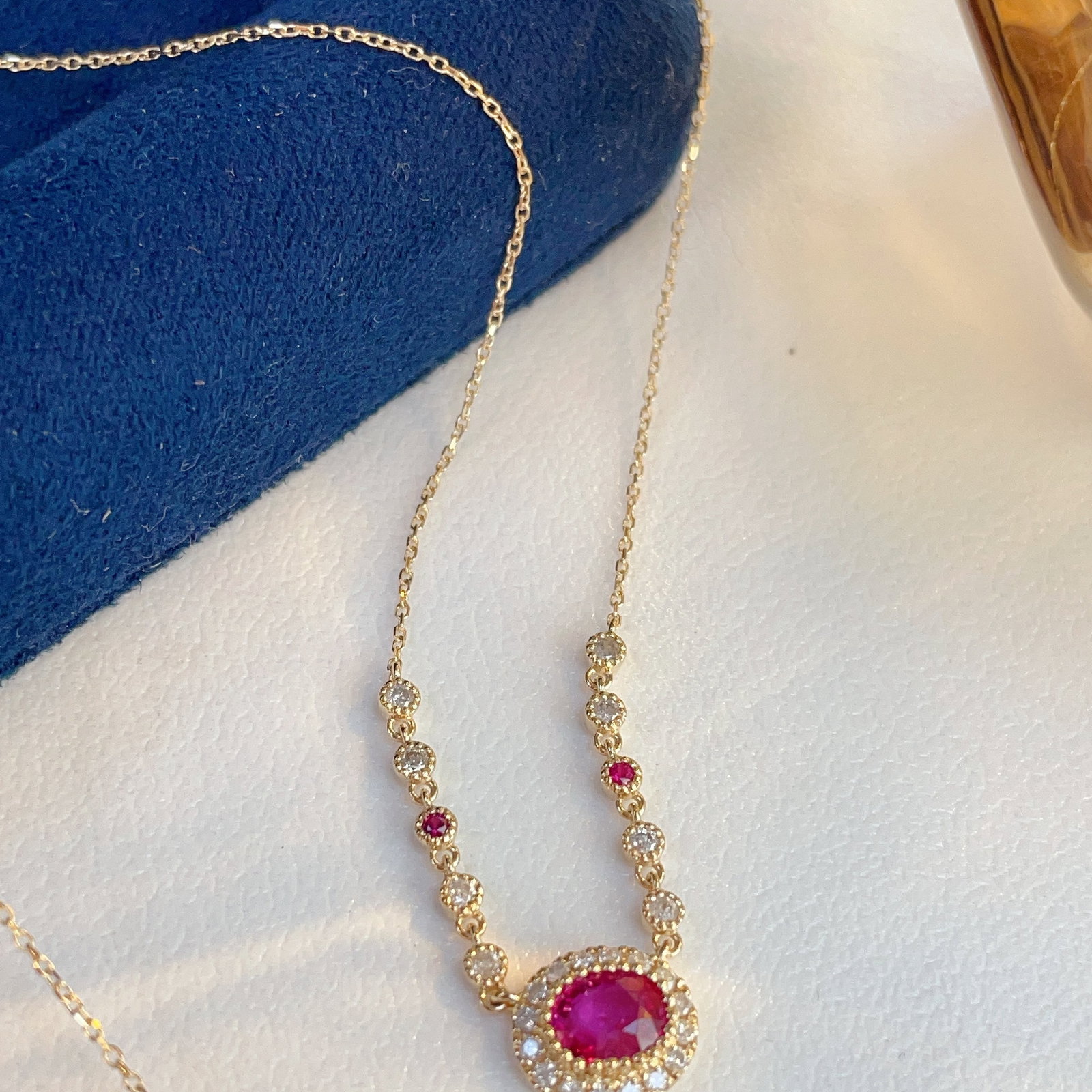 14k Gold 0.69 Ctw Natural Ruby & Diamond Necklace: Ref:231092183 // gold content:14k gold // main gemstone:ruby // shape:oval // carat weight:0. 53ct // color:red // treatment:natural // // adjacent gemstone 2 : diamond // shape:round // carat