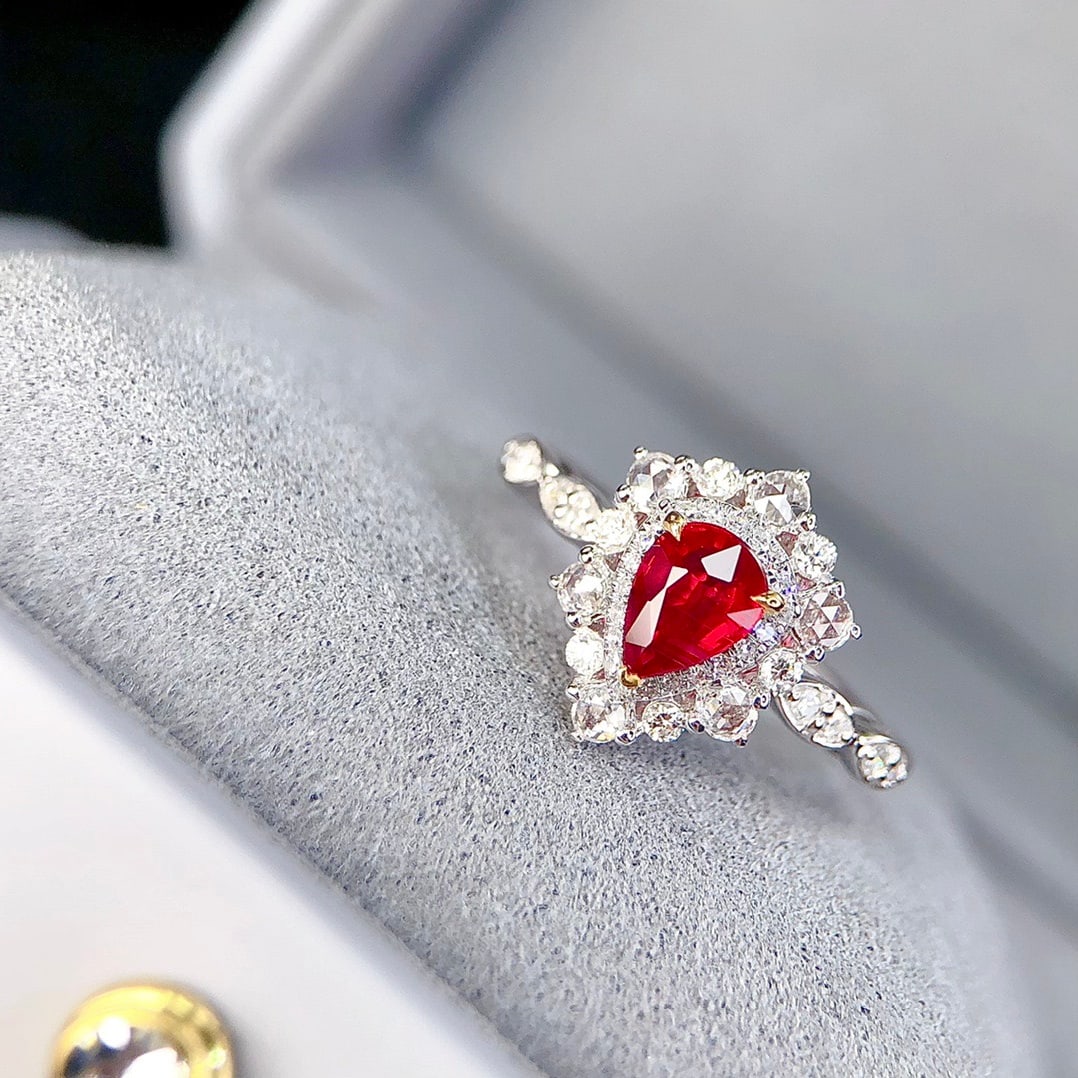 14k Gold 1.07 Ctw Natural Ruby & Diamond Ring: Ref:231092322 // gold content:14k gold // ring size:7. 25us // // main gemstone:ruby // shape:pear // carat weight:0. 70ct // color:pigeonblood red // treatment:natural // // adjacent gemstone 2 :