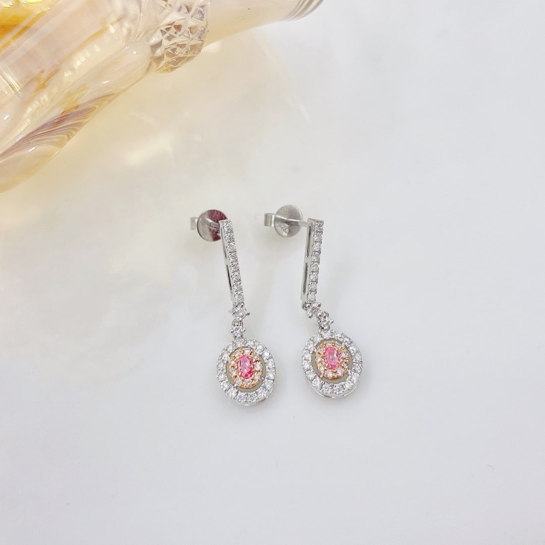 14k Gold 0.56 Ctw Natural Pink Diamond & Diamond Earrings: Ref:231092376 // gold content:14k gold // main gemstone:pink diamond // shape:oval // carat weight:0. 10ct // color:pink // treatment:natural // // adjacent gemstone 2 : diamond // shape:round //