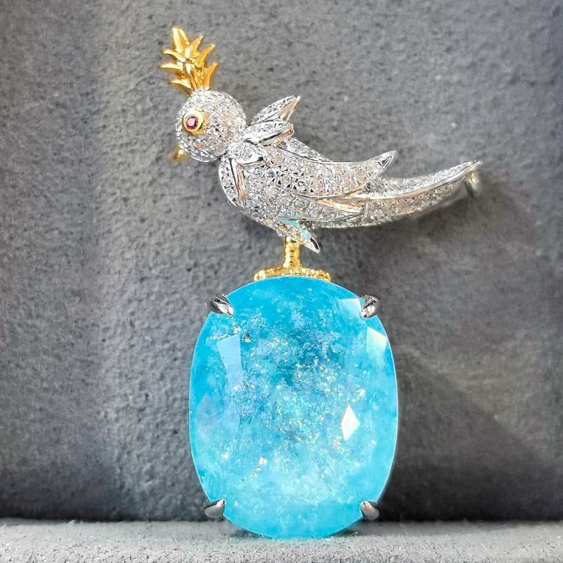 14k Gold 16.64 Ctw Natural Paraiba Tourmaline & Diamond Brooch/pendant( Without Chain ): Ref:231092424 // gold content:14k gold // main gemstone:paraiba tourmaline // shape:oval // carat weight:16. 12ct // color:blue // treatment:natural // cut grade:g // // adjacent gemstone 2 : diamond