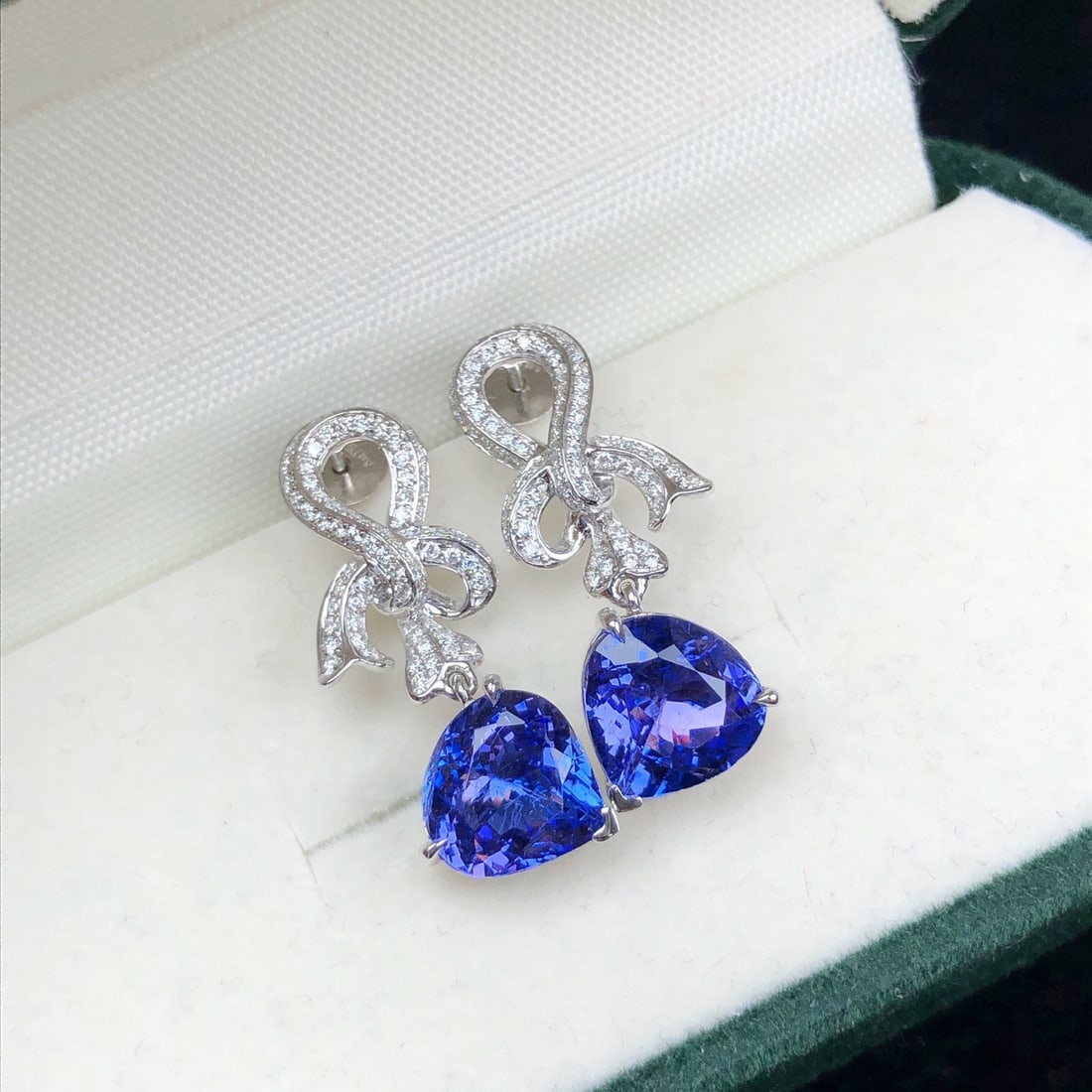 14k Gold 3.83 Ctw Natural Tanzanite & Diamond Earrings: Ref:231092449 // gold content:14k gold // main gemstone:tanzanite // shape:pear // carat weight:3. 36ct // color:blue // treatment:natural // // adjacent gemstone 2 : diamond // shape:round // carat