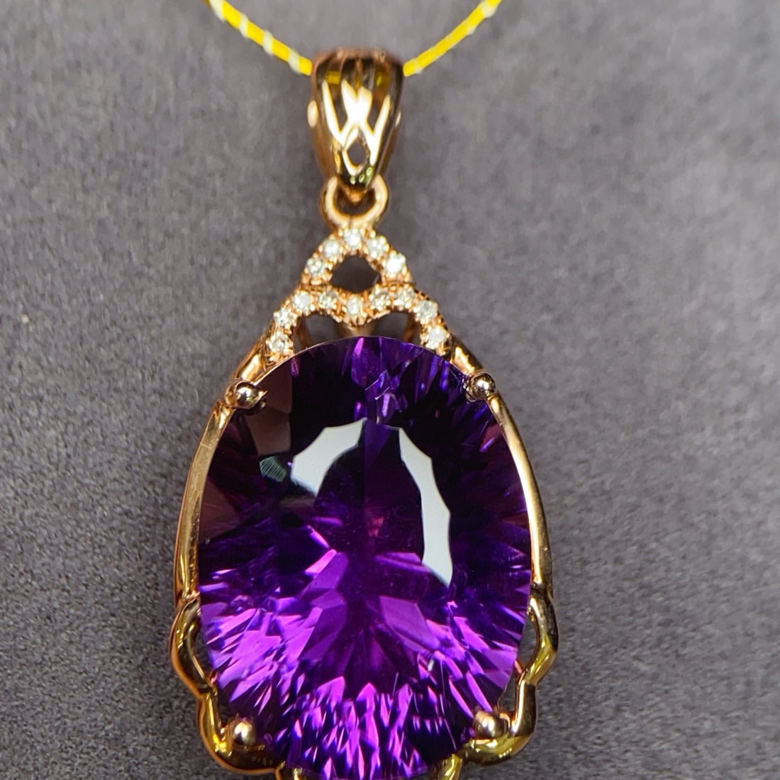 14k Gold 9.24 Ctw Natural Amethyst & Diamond Pendant( Without Chain ): Ref:231093055 // gold content:14k gold // main gemstone:amethyst // shape:oval // carat weight:9. 2ct // color:purple // treatment:natural // // adjacent gemstone 2 : diamond // number of stones:15