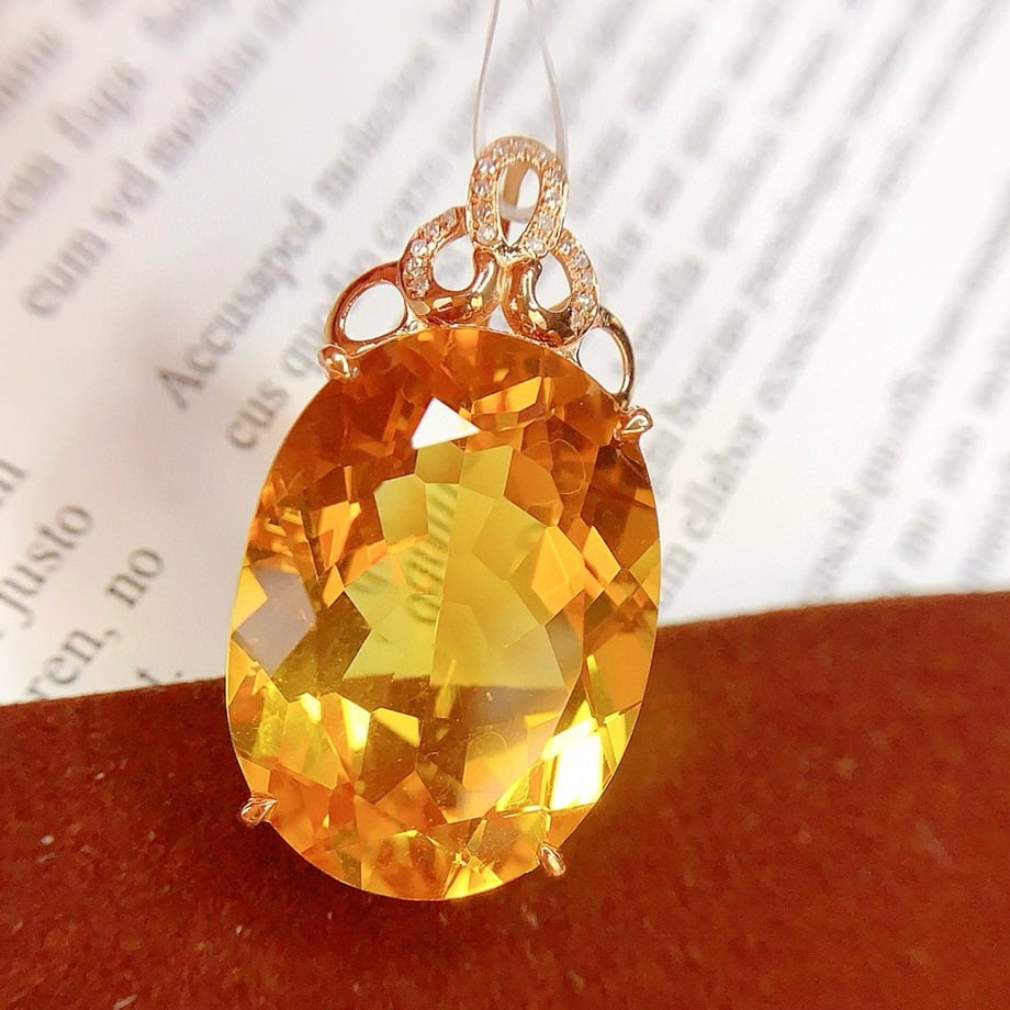 14k Gold 26.85 Ct Natural Citrine & Diamond Pendant( Without Chain ): Ref:231093095 // gold content:14k gold // main gemstone:citrine // shape:oval // carat weight:26. 85ct // color:yellow // treatment:natural // // adjacent gemstone 2 : diamond // number of stones:21