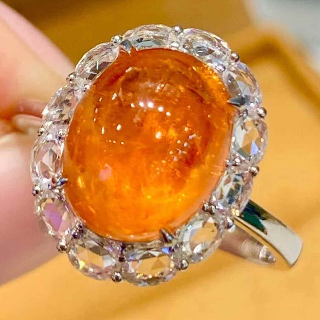 14k Gold 5.2 Ct Natural Spessartine & Sapphire Ring: Ref:231093169 // gold content:14k gold // ring size:7. 25us // // main gemstone:spessartine // shape:oval // carat weight:5. 2ct // color:orange // treatment:natural // // adjacent gemstone 2 :