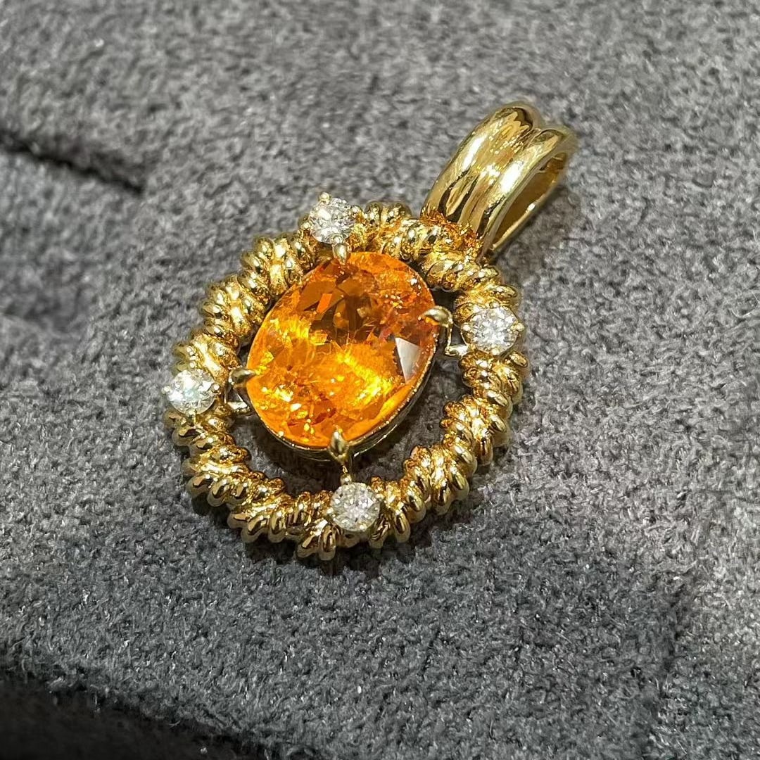 14k Gold 2.28 Ctw Natural Spessartine & Diamond Pendant( Without Chain ): Ref:231093175 // gold content:14k gold // main gemstone:spessartine // shape:oval // carat weight:2. 17ct // color:orange // treatment:natural // // adjacent gemstone 2 : diamond // shape:round //