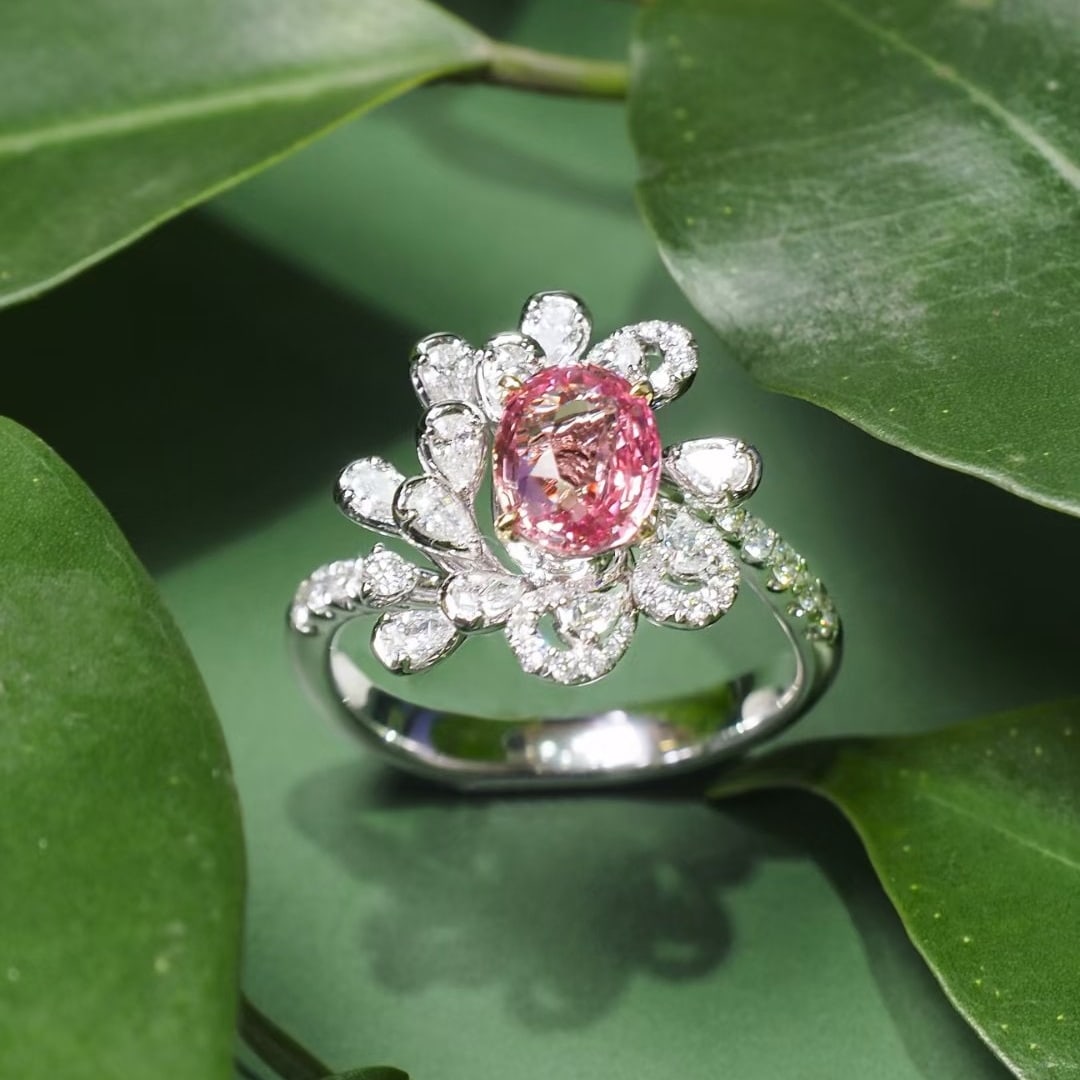 14k Gold 1.55 Ct Natural Padparadscha Sapphire & Diamond Ring: Ref:231094001 // gold content:14k gold // ring size:7. 25us // // main gemstone:padparadscha sapphire // shape:oval // carat weight:1. 55ct // color:orangish pink // treatment:natural // // adjacent g