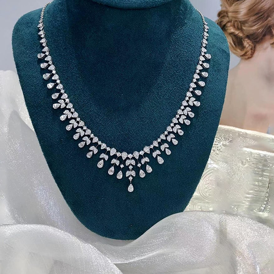 14k Gold 4.74 Ct Natural H Diamond Necklace: Ref:231094007 // gold content:14k gold // main gemstone:diamond // shape:multiple // carat weight:4. 74ct // clarity grade:vs-si // color:h // treatment:natural // Condition: New Low Estimate: 17000.0