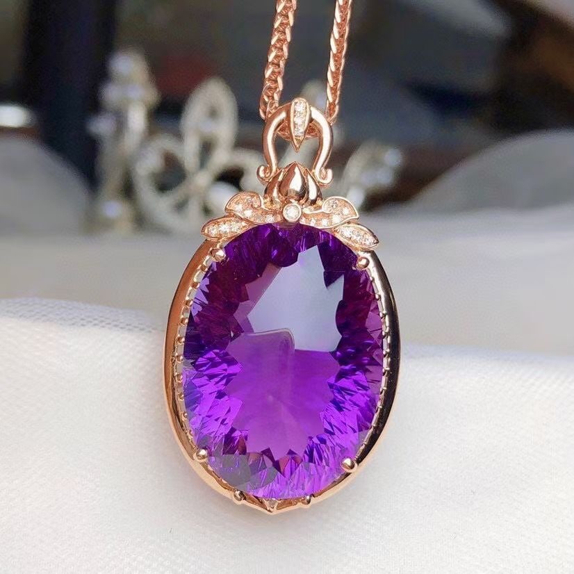 14k Gold 24.90 Ct Natural Amethyst & Diamond Pendant( Without Chain ): Ref:231094025 // gold content:14k gold // main gemstone:amethyst // shape:oval // carat weight:24. 90ct // color:purple // treatment:natural // // adjacent gemstone 2 : diamond // number of stones:21 