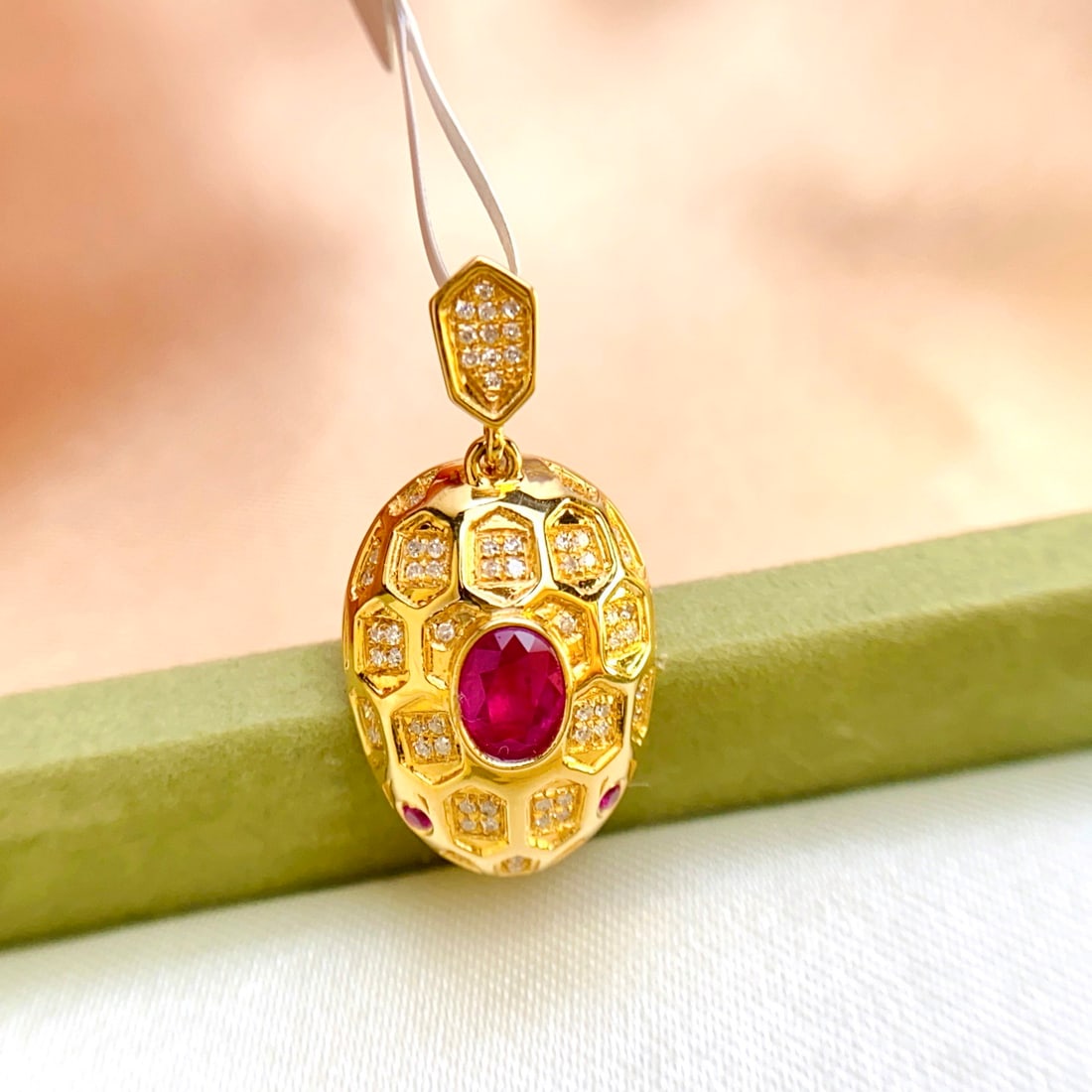 14k Gold 0.55 Ct Natural Ruby & Diamond Pendant( Without Chain ): Ref:231094162 // gold content:14k gold // main gemstone:ruby // shape:oval // carat weight:0. 55ct // color:red // treatment:natural // // adjacent gemstone 2 : diamond // number of stones:63 //