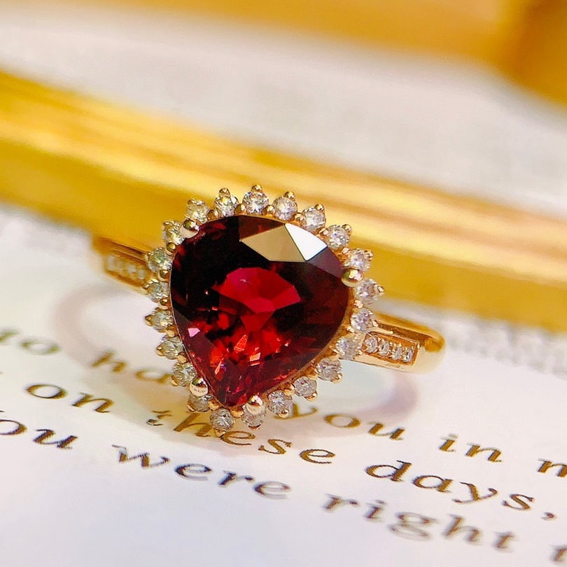 14k Gold 2.8 Ct Natural Tourmaline & Diamond Ring: Ref:231094417 // gold content:14k gold // ring size:7. 25us // // main gemstone:tourmaline // shape:pear // carat weight:2. 8ct // color:red // treatment:natural // // adjacent gemstone 2 : diamond