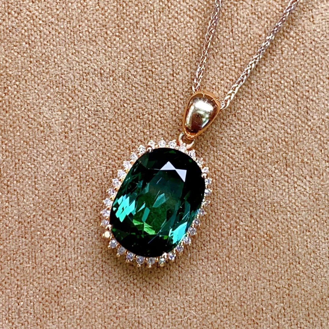 14k Gold 5.26 Ctw Natural Tourmaline & Diamond Pendant( Without Chain ): Ref:231096050 // gold content:14k gold // main gemstone:tourmaline // shape:oval // carat weight:5. 1ct // color:green // treatment:natural // // adjacent gemstone 2 : diamond // number of stones:32