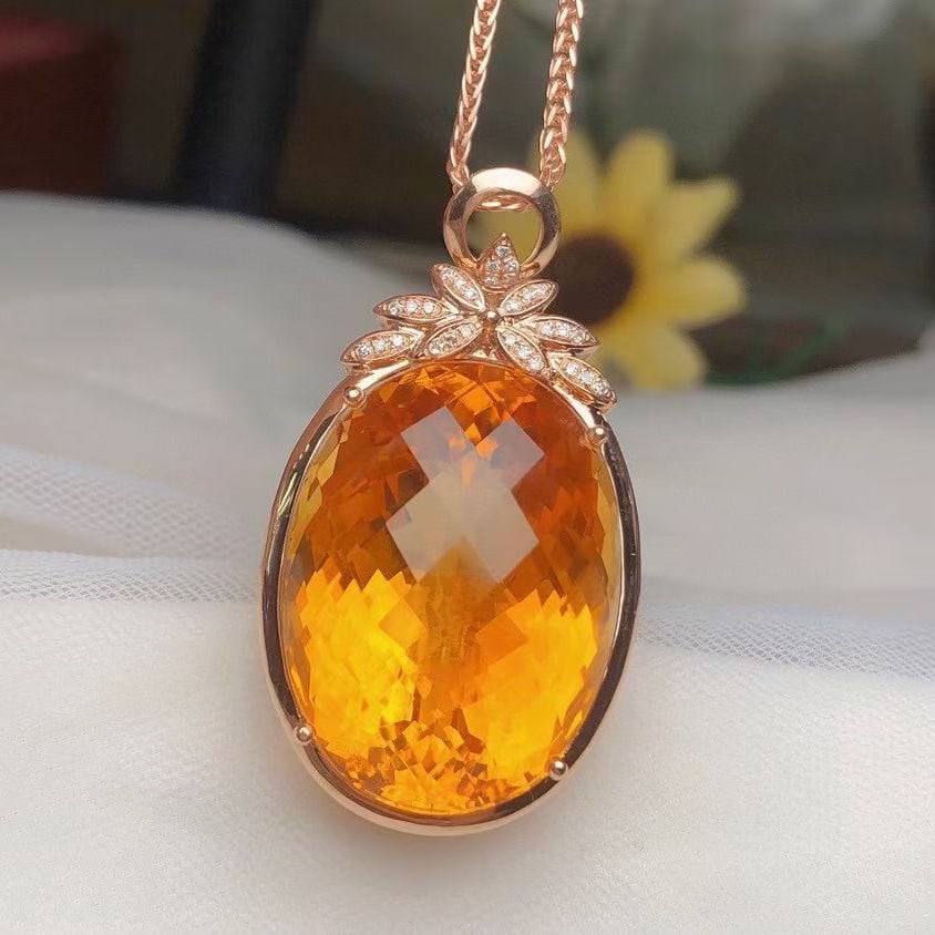 14k Gold 40.50 Ct Natural Citrine & Diamond Pendant( Without Chain ): Ref:231096302 // gold content:14k gold // main gemstone:citrine // shape:oval // carat weight:40. 50ct // color:yellow // treatment:natural // // adjacent gemstone 2 : diamond // number of stones:29 /