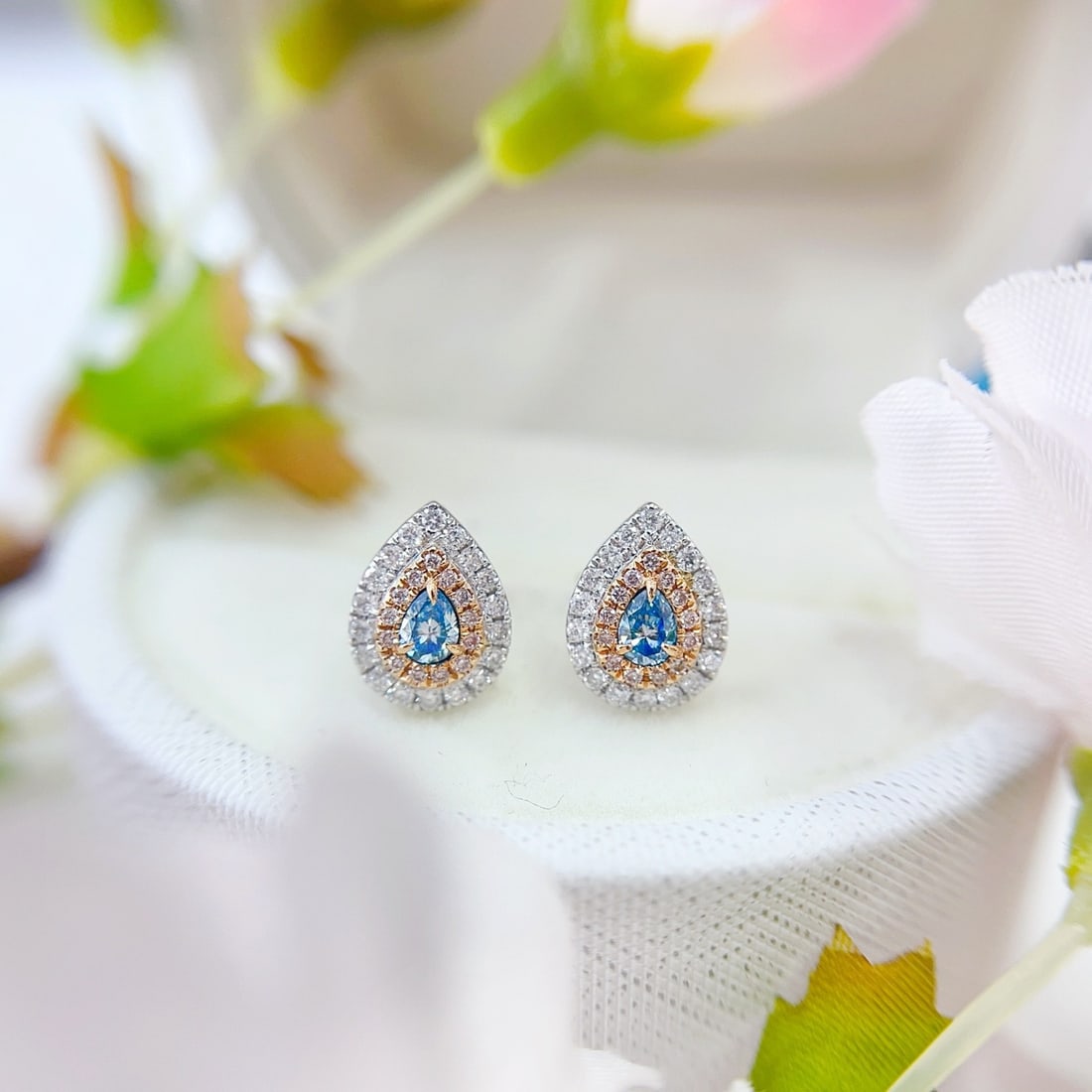 14k Gold 0.62 Ctw Natural Blue Diamond & Diamond Earrings: Ref:231096373 // gold content:14k gold // main gemstone:blue diamond // shape:pear // carat weight:0. 24ct // color:blue // treatment:natural // // adjacent gemstone 2 : diamond // shape:round //