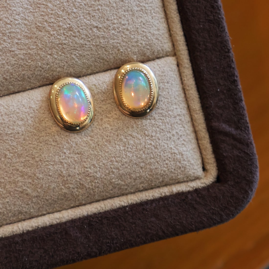 14k Gold 1.2 Ct Natural Opal Earrings: Ref:231096403 // gold content:14k gold // main gemstone:opal // shape:oval // carat weight:1. 2ct // color:color // treatment:natural // Condition: New Low Estimate: 1100 High Estimate: 1700