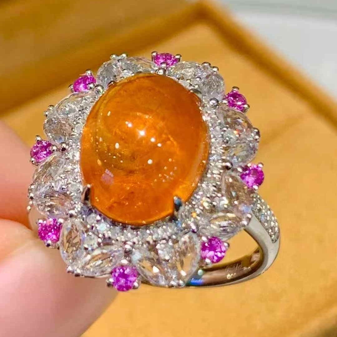 14k Gold 6.35 Ct Natural Spessartine & Diamond Ring: Ref:231097087 // gold content:14k gold // ring size:7. 25us // // main gemstone:spessartine // shape:oval // carat weight:6. 35ct // color:orange // treatment:natural // // adjacent gemstone 2 :