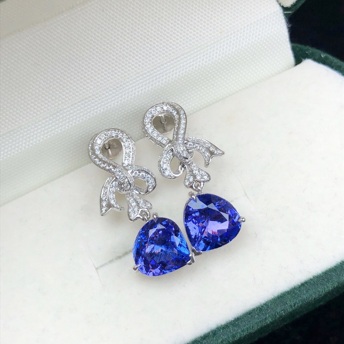 14k Gold 3.83 Ctw Natural Tanzanite & Diamond Earrings: Ref:231097092 // gold content:14k gold // main gemstone:tanzanite // shape:pear // carat weight:3. 36ct // color:blue // treatment:natural // // adjacent gemstone 2 : diamond // shape:round // carat w