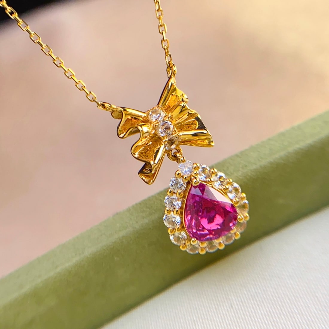 14k Gold 1.10 Ct Natural Ruby & Sapphire Necklace: Ref:231098062 // gold content:14k gold // main gemstone:ruby // shape:pear // carat weight:1. 10ct // color:red // treatment:natural // // adjacent gemstone 2 : sapphire // number of stones:15 //
