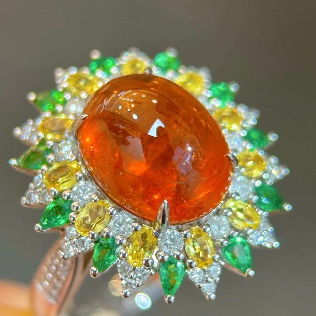 14k Gold 7.50 Ctw Natural Spessartine & Diamond Ring: Ref:231098304 // gold content:14k gold // ring size:7. 25us // // main gemstone:spessartine // shape:oval // carat weight:6. 98ct // color:orange // treatment:natural // // adjacent gemstone 2 :